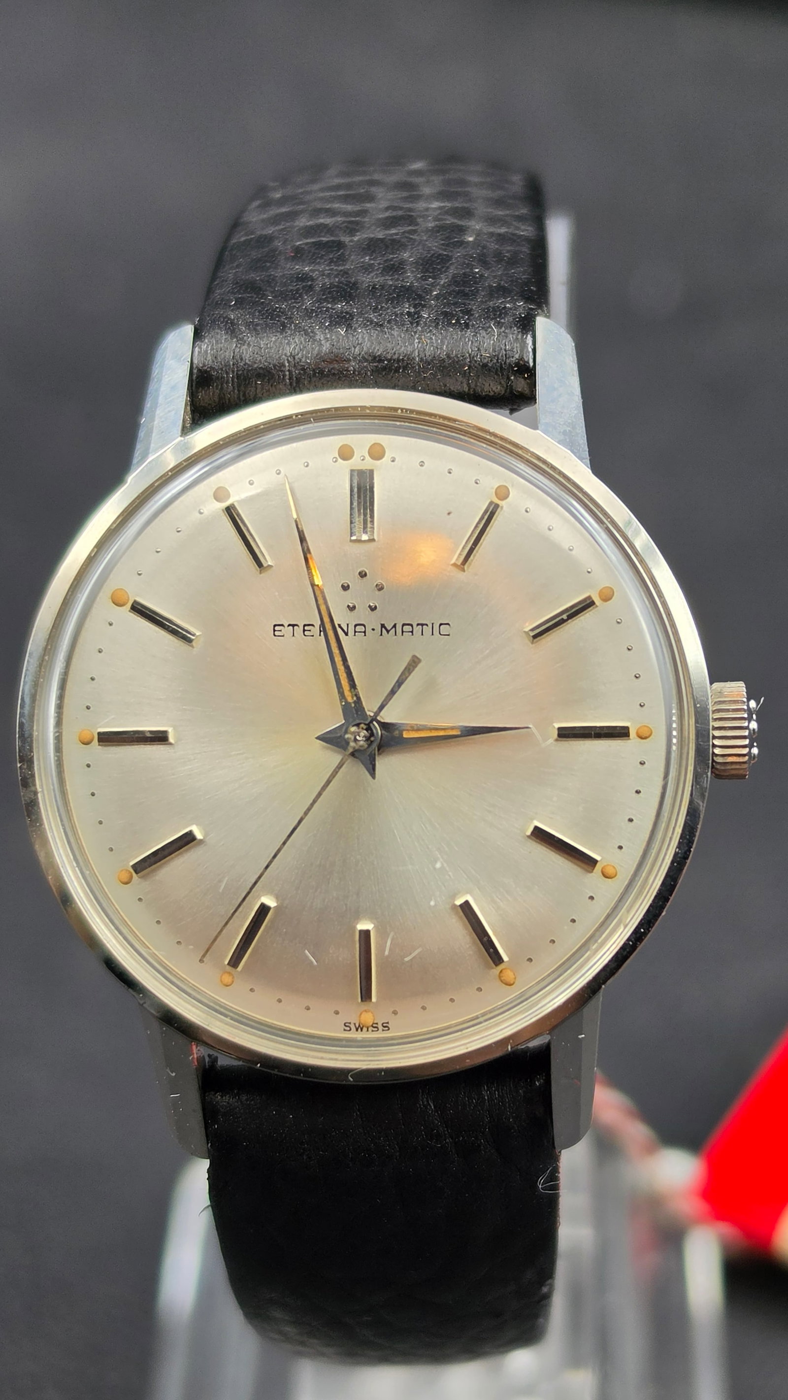 Vintage c.1960s Eterna-Matic NOS 31mm Stainless Steel Automatic 17J w/ Box & Papers: NOTE: This watch is being sold as New Old Stock — it retains its original unissued Eterna-Matic strap with the factory red-and-white hang tag still attached, and is presented in its original Eterna