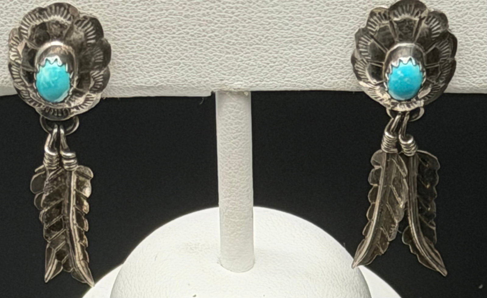 4g-Vintage Sterling Silver Turquoise Feather Dangle Earrings Southwestern: Beautiful vintage sterling silver dangle earrings featuring hand-stamped flower conchos set with oval turquoise stones. Each earring is accented with dangling feather charms, creating a classic Southw