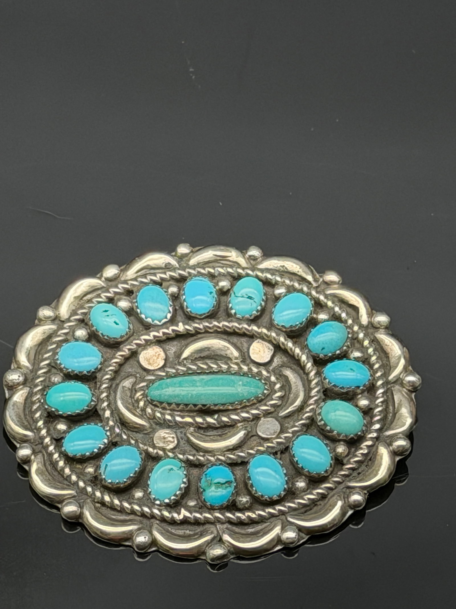 25g-Vintage SILMAN Sterling Silver Turquoise Cluster Brooch Pin: Beautiful vintage sterling silver brooch by SILMAN featuring a traditional Southwestern cluster design set with multiple blue turquoise cabochons. The piece displays classic ropework, bead accents, an