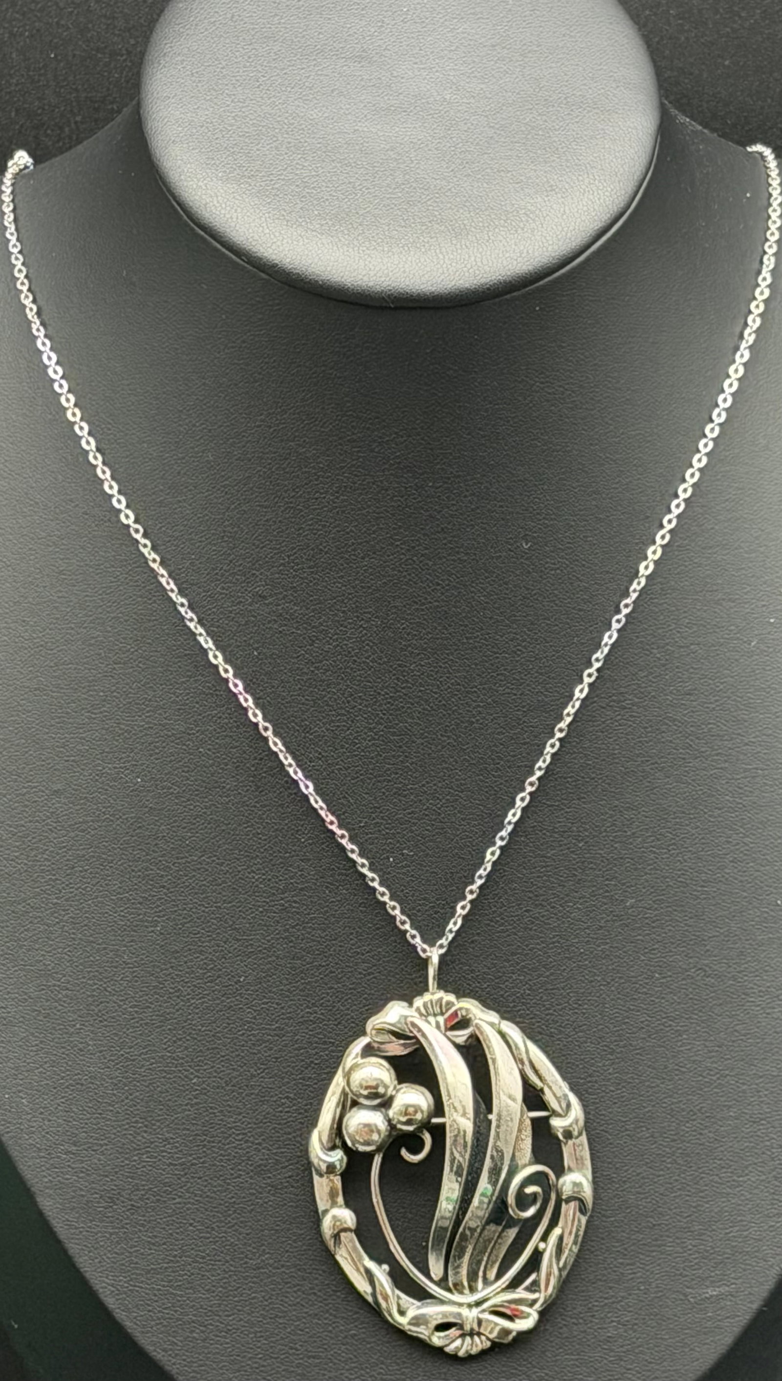 11g-Vintage Sterling Silver Art Nouveau Brooch Pendant Necklace: Elegant vintage sterling silver Art Nouveau-inspired brooch pendant featuring flowing ribbon, floral, and berry motifs in an openwork design. Marked STERLING with maker’s hallmark. Originally a broo