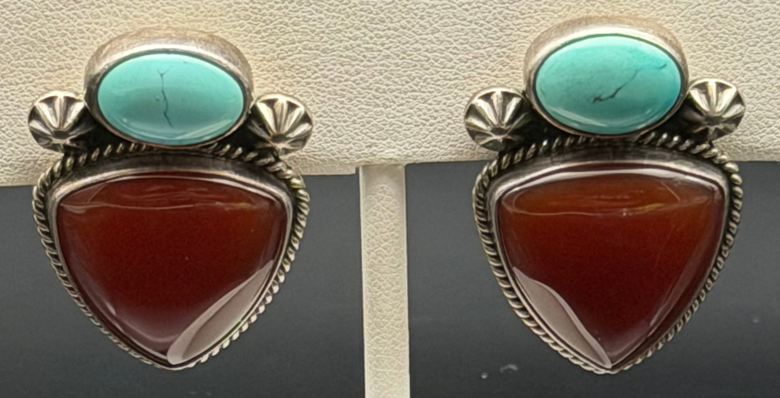 22g-Reve Sterling Silver Turquoise and Carnelian Clip-On Earrings: A striking pair of southwestern-style clip-on earrings featuring a dual-stone design.Each earring showcases an oval turquoise cabochon set at the top in a smooth bezel setting, paired with a larger tr