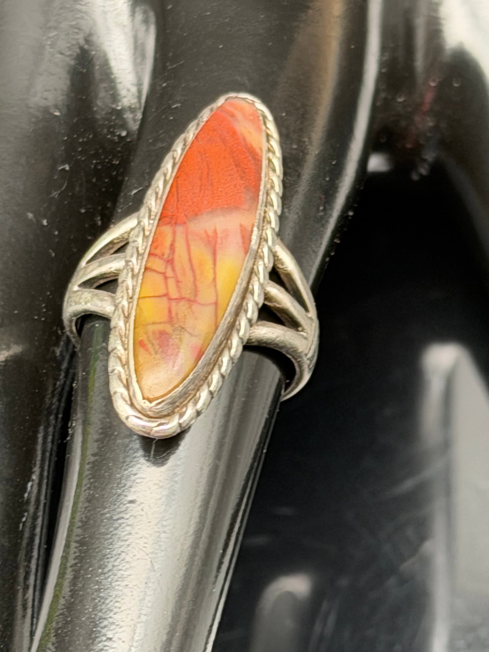 7g-Vintage Sterling Silver STER Marquise Orange Jasper Agate Ring: Vintage sterling silver ring marked “STER,” featuring a striking marquise-shaped orange/red gemstone with natural matrix patterns. The ring has a classic Southwestern or artisan-inspired desig