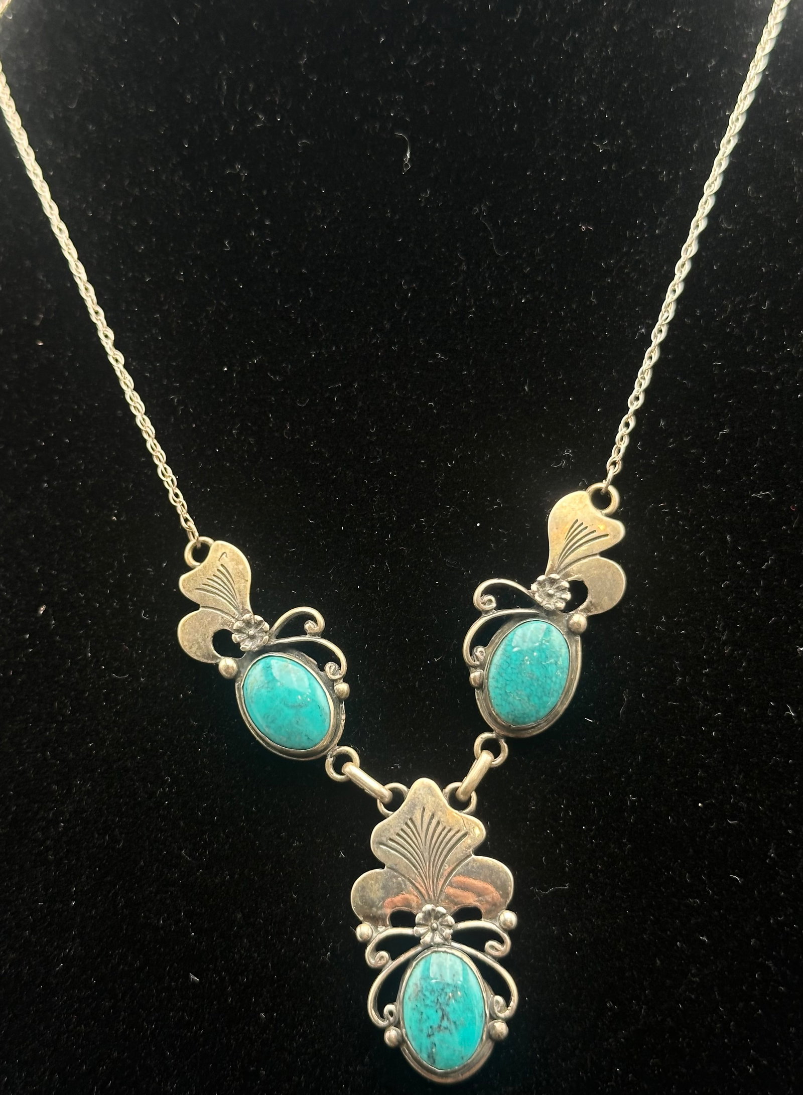 Vintage Native American Sterling Silver Turquoise Necklace 16g: Vintage Native American sterling silver necklace featuring three natural turquoise cabochons in a handcrafted floral design. The necklace is marked STERLING and decorated with traditional Southwestern