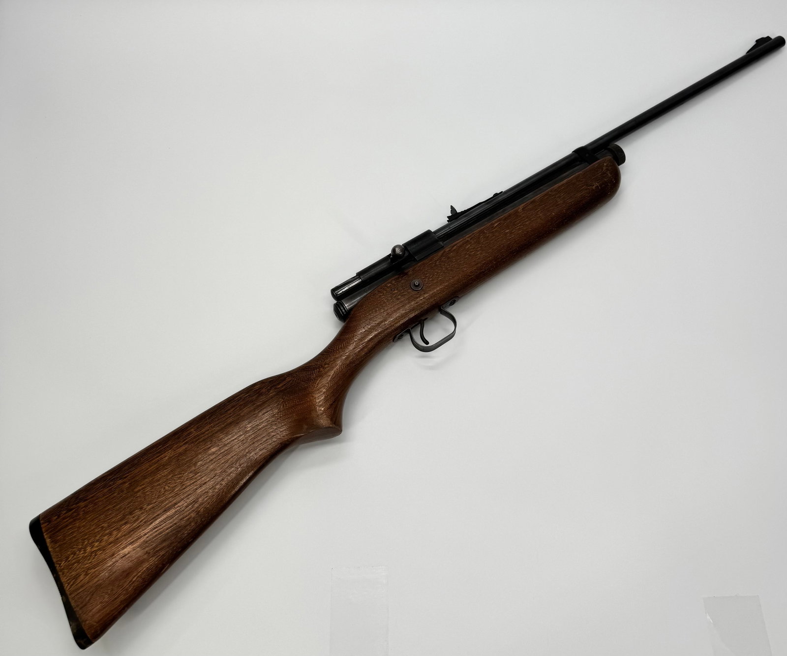 Wards Western Field .22 S-L-LR Bolt Action Rifle: Vintage Wards Western Field bolt-action rifle chambered for .22 Short, Long, and Long Rifle cartridges. Features a hardwood stock, blued finish, tubular magazine, and adjustable rear sight. Sold throu