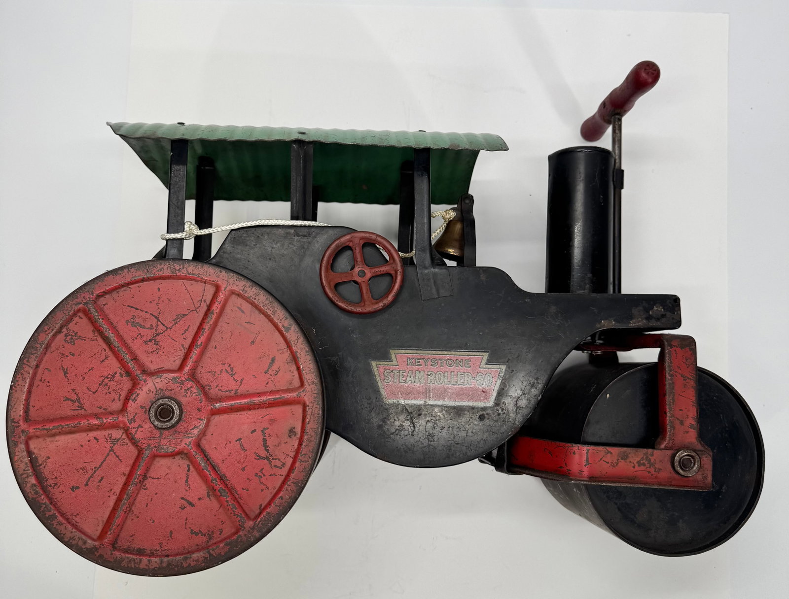 Vintage Keystone Steam Roller No. 60 Pressed Steel Toy: Vintage Keystone Steam Roller No. 60 ride-on/push toy manufactured by Keystone Manufacturing Co., Boston, Massachusetts. Constructed of pressed steel with original black and red paint, large rear driv