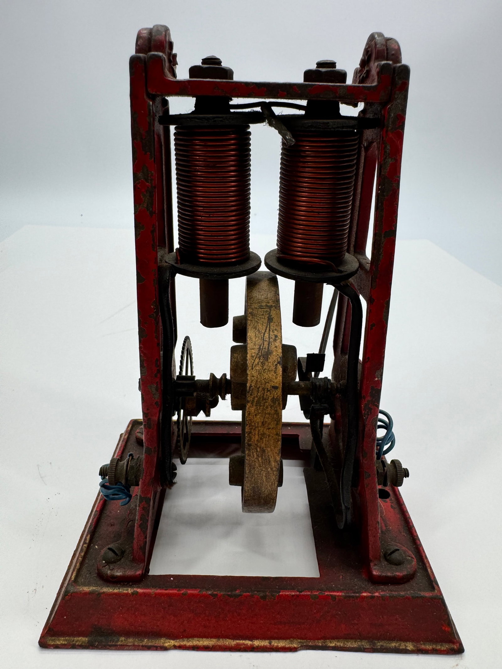 Antique Weeden Belt-Driven Toy Electric Motor: Original antique Weeden belt-driven toy electric motor dating to the early 1900s. Features a cast iron base with upright frame, pulleys, and exposed mechanical components designed for use with a belt-