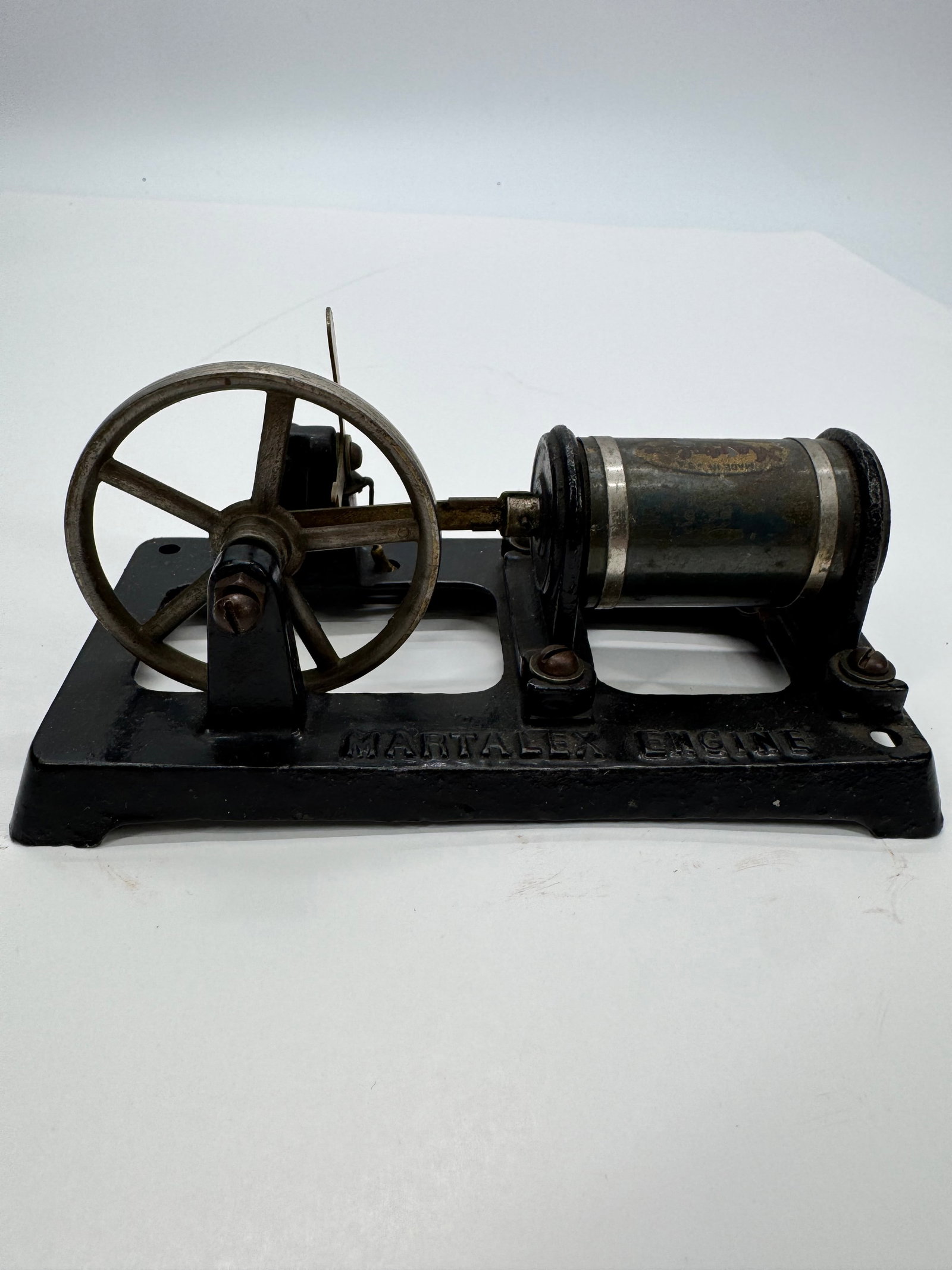 Martalex Electromagnetic Engine: Vintage Martalex electromagnetic engine manufactured by Martalex Mfg. Co., U.S.A. Features a cast-iron base embossed “Martalex Engine,” large flywheel, oscillating armature mechanism, and orig
