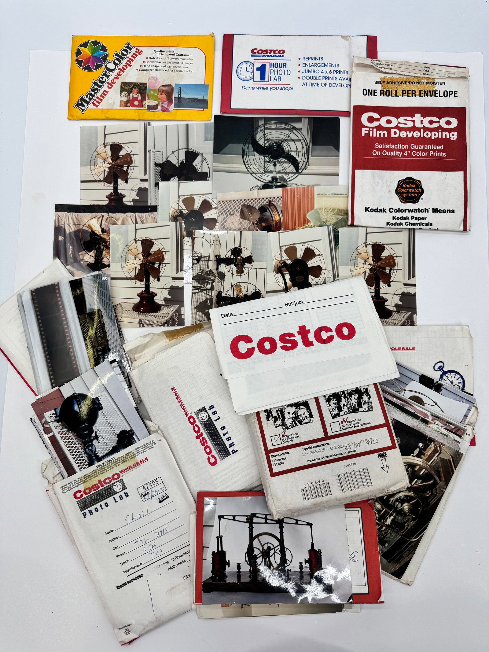 Vintage Antique Fan Photo Archive Lot w/ Negatives & Costco Photo Lab Envelopes: Vintage archive lot consisting of developed photographs, negatives, and photo lab envelopes documenting antique electric fans and a model steam engine. Includes Costco and Kodak Colorwatch developing 