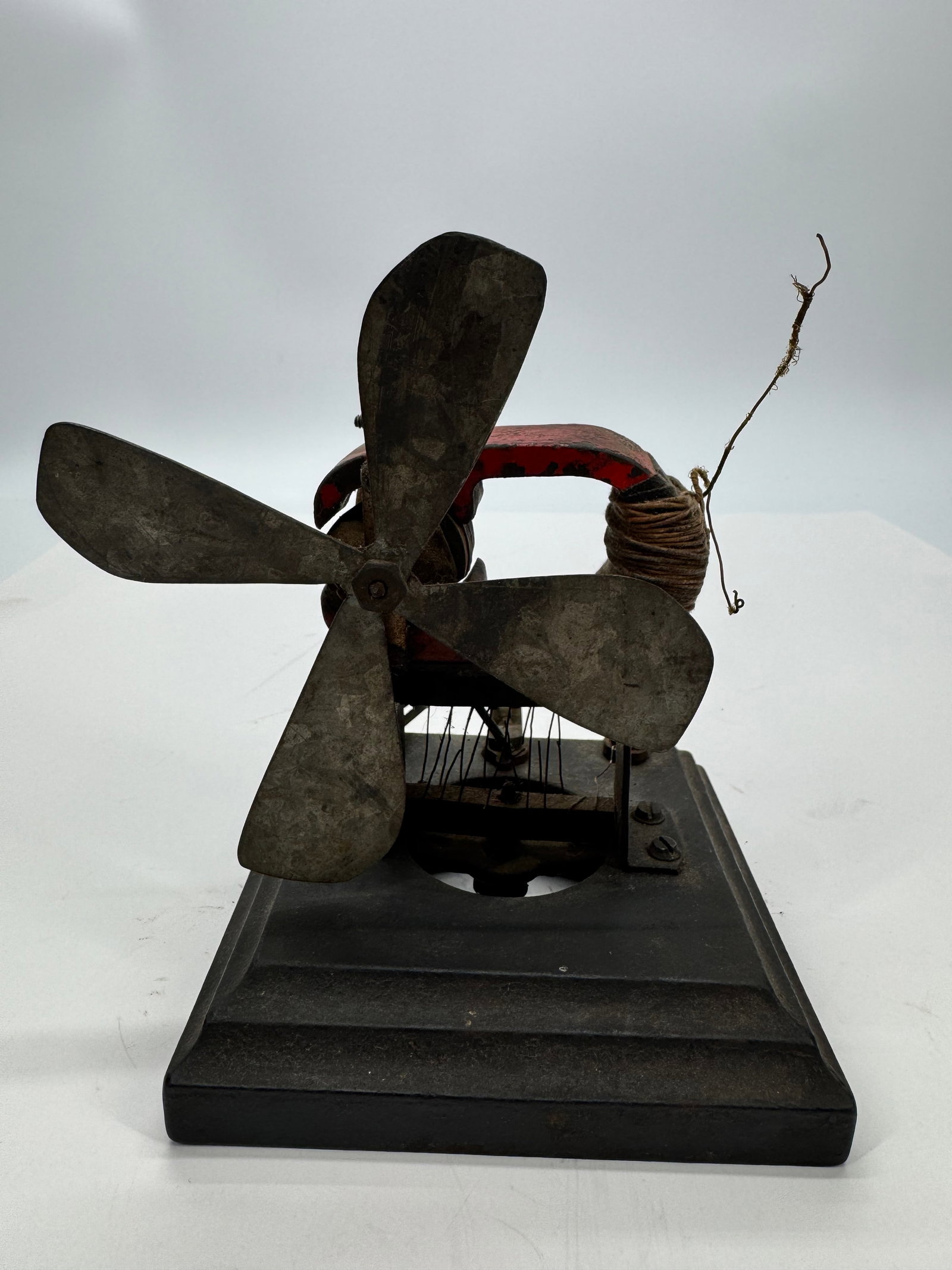 Toy Bipolar Fan Motor: Original antique toy bipolar electric fan motor dating to the early 1900s. Features a cast iron base with exposed bipolar field coils and a small metal fan blade, representing an early demonstration o