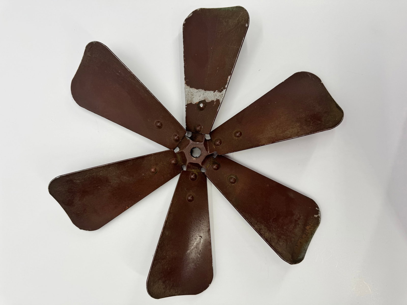 Antique 6-Blade Metal Electric Fan Blade Assembly c.1900-1920: Antique six-blade pressed steel electric fan blade assembly with cast hub and hexagonal center mount. Features original aged brown finish with visible wear and remnants of earlier paint. Likely remove
