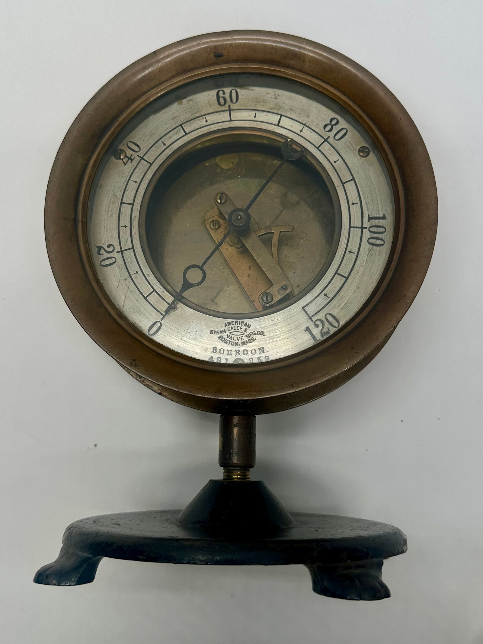 Antique American Steam Gauge & Valve Co. Bourdon Pressure Gauge on Stand: Antique Bourdon pressure gauge by American Steam Gauge & Valve Mfg. Co., Boston, Mass. Brass-cased 0–120 PSI gauge with visible movement and original cast-iron display stand. Circa 1890–1915. Unte