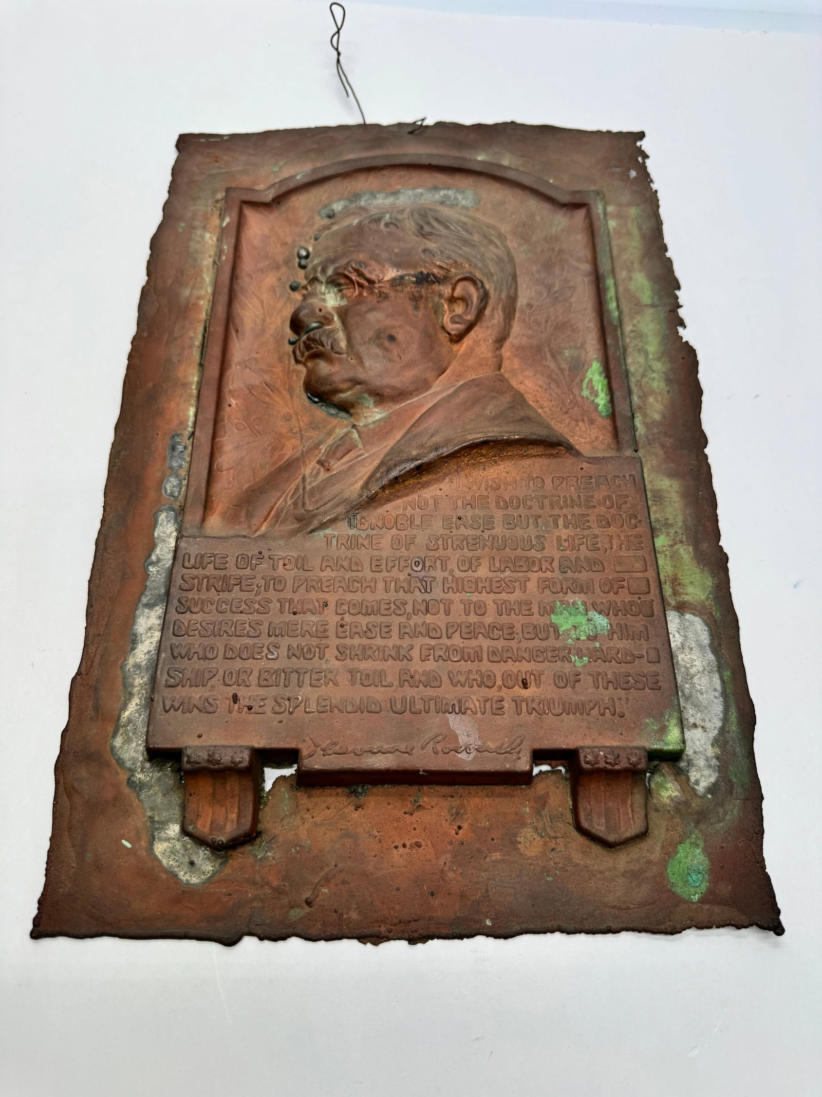 Antique Theodore Roosevelt Repoussé Copper Wall Plaque: Early 20th-century repoussé copper plaque depicting Theodore Roosevelt in profile with his “Life of Toil and Effort” quote from The Strenuous Life speech. Features a facsimile signature and o
