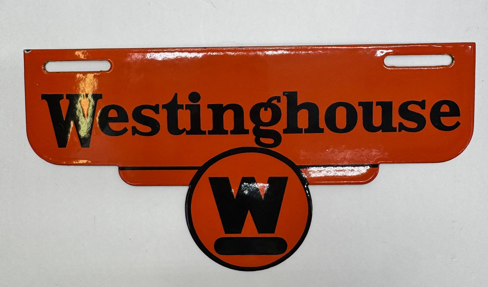 Vintage Westinghouse Porcelain Dealer Display Sign: Vintage Westinghouse Electric porcelain enamel dealer sign featuring black “Westinghouse” lettering and the classic orange-and-black “W” logo. Approx. 10” × 13”. Designed 