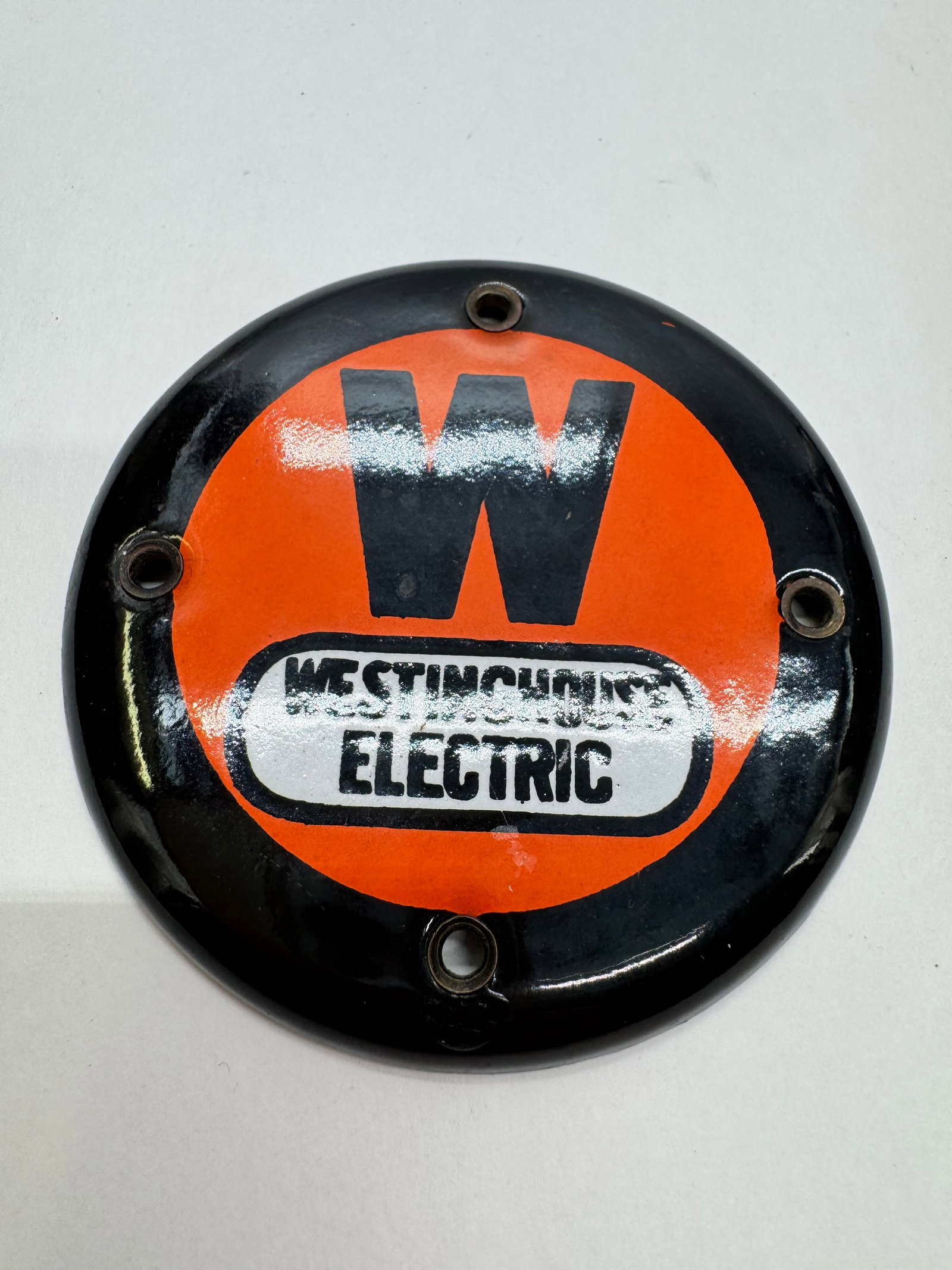 Vintage Westinghouse Electric 3” Porcelain Advertising Emblem: Original Westinghouse Electric porcelain enamel advertising emblem featuring the classic orange and black “W” logo. Measures approximately 3 inches in diameter with four mounting holes. Displa