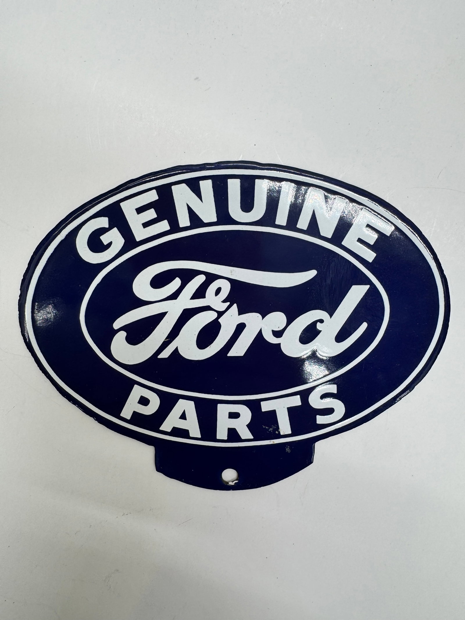 Vintage Genuine Ford Parts License Plate Topper: Original embossed steel Genuine Ford Parts license plate topper featuring the classic blue and white Ford design. Shows light wear from age and use but retains excellent color and display appeal. A de