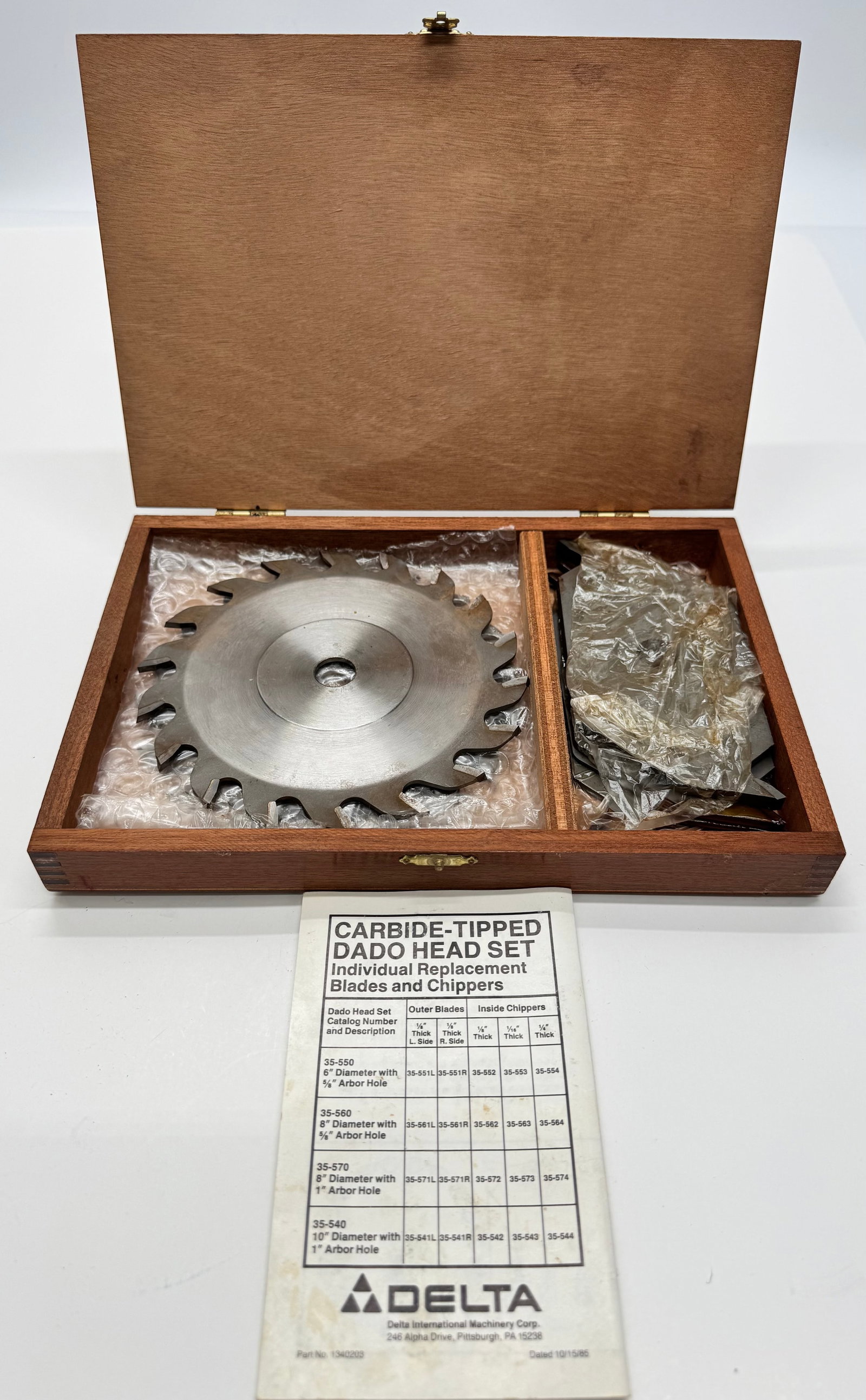 Delta Carbide-Tipped Dado Head Set w/ Wood Case: Vintage Delta carbide-tipped dado head set in the original wooden storage case with instruction sheet and multiple chippers. Includes two outer blades and assorted cutters. Carbide teeth appear intact