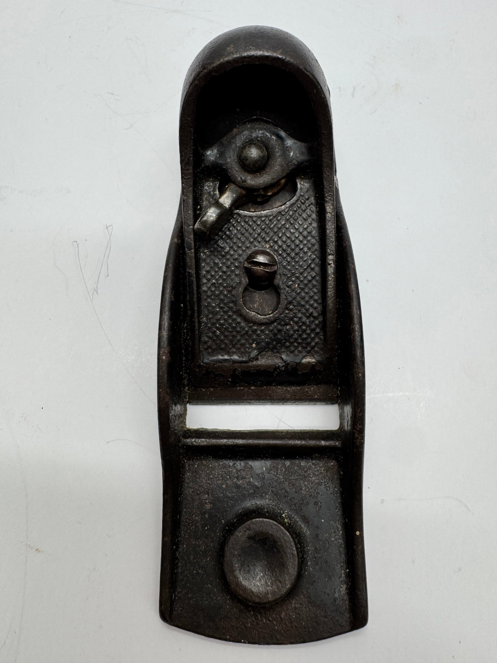 Vintage Stanley No. 220 Adjustable Block Plane USA: Vintage Stanley No. 220 cast iron block plane made in the USA. Features an adjustable blade mechanism for precision woodworking. Shows honest age-related wear, surface oxidation, and finish loss consi