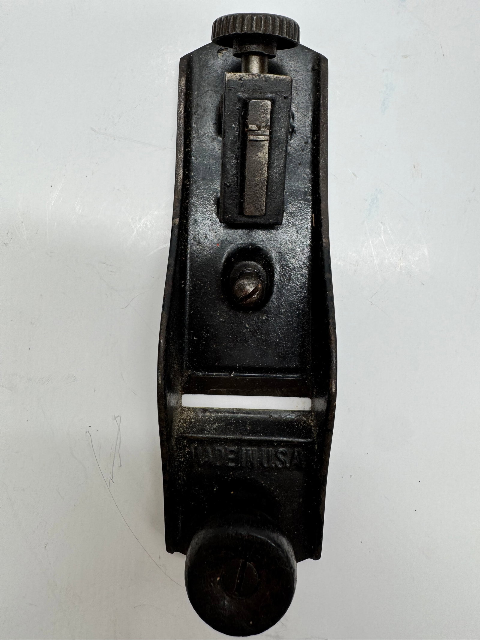 Vintage Stanley No. 220 Adjustable Block Plane Made in USA: Vintage Stanley No. 220 cast iron block plane marked “Made in U.S.A.” Features adjustable depth control with original hardwood front knob. Shows honest wear and patina from use but appears com