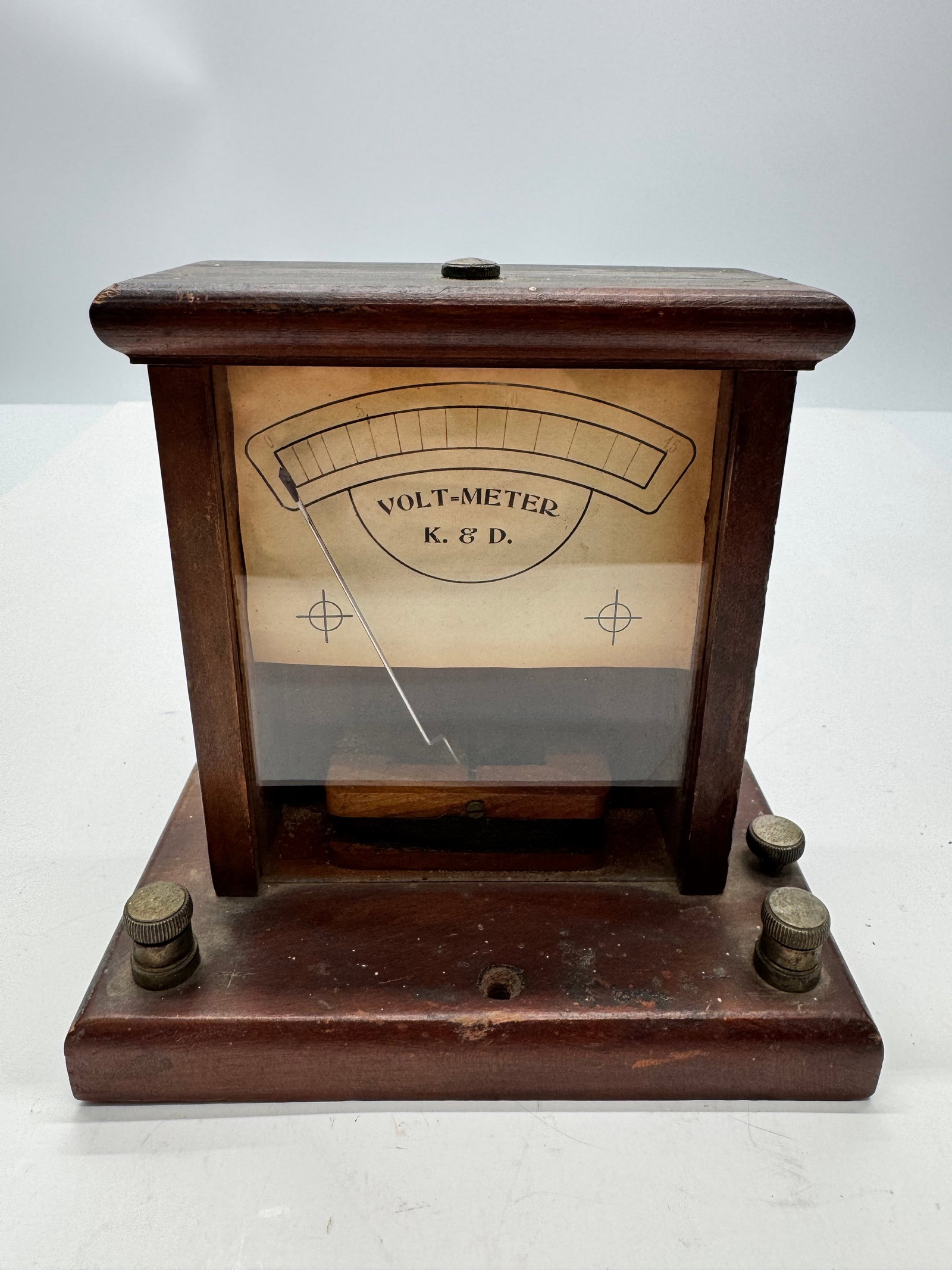 Antique K&D Kroeber & Dake Wooden Volt Meter Electrical Test Instrument: Antique K&D (Kroeber & Dake) volt meter housed in a wooden case with glass front and original scale marked 0–15 volts. Features exposed needle movement and brass terminals. Early electrical testing 