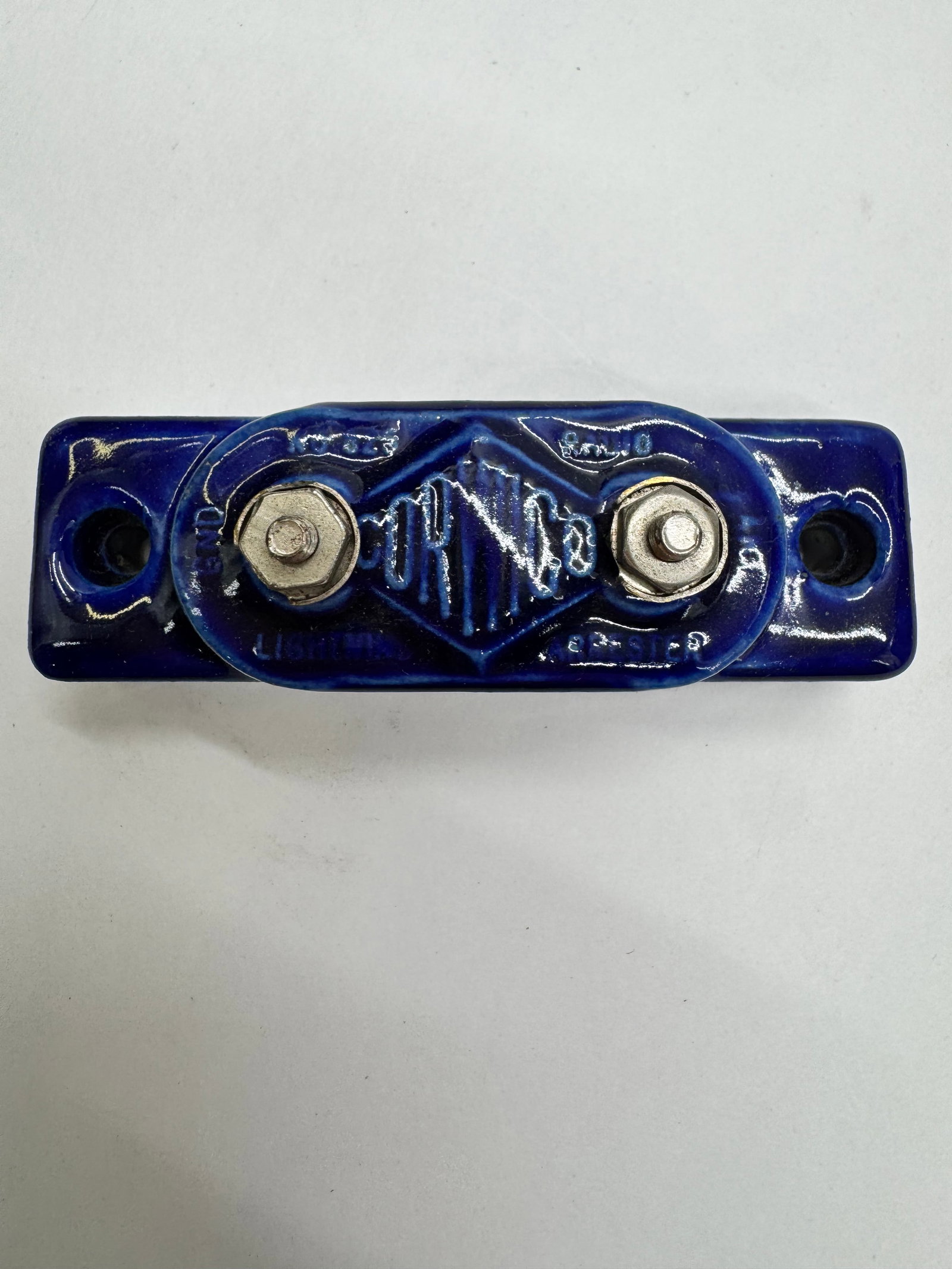 Antique ORRICO Blue Porcelain Electrical Fuse Block: Antique blue glazed porcelain electrical fuse block by ORRICO. Features embossed maker’s mark, heavy porcelain construction, and original terminal hardware. Used in early commercial and industrial e