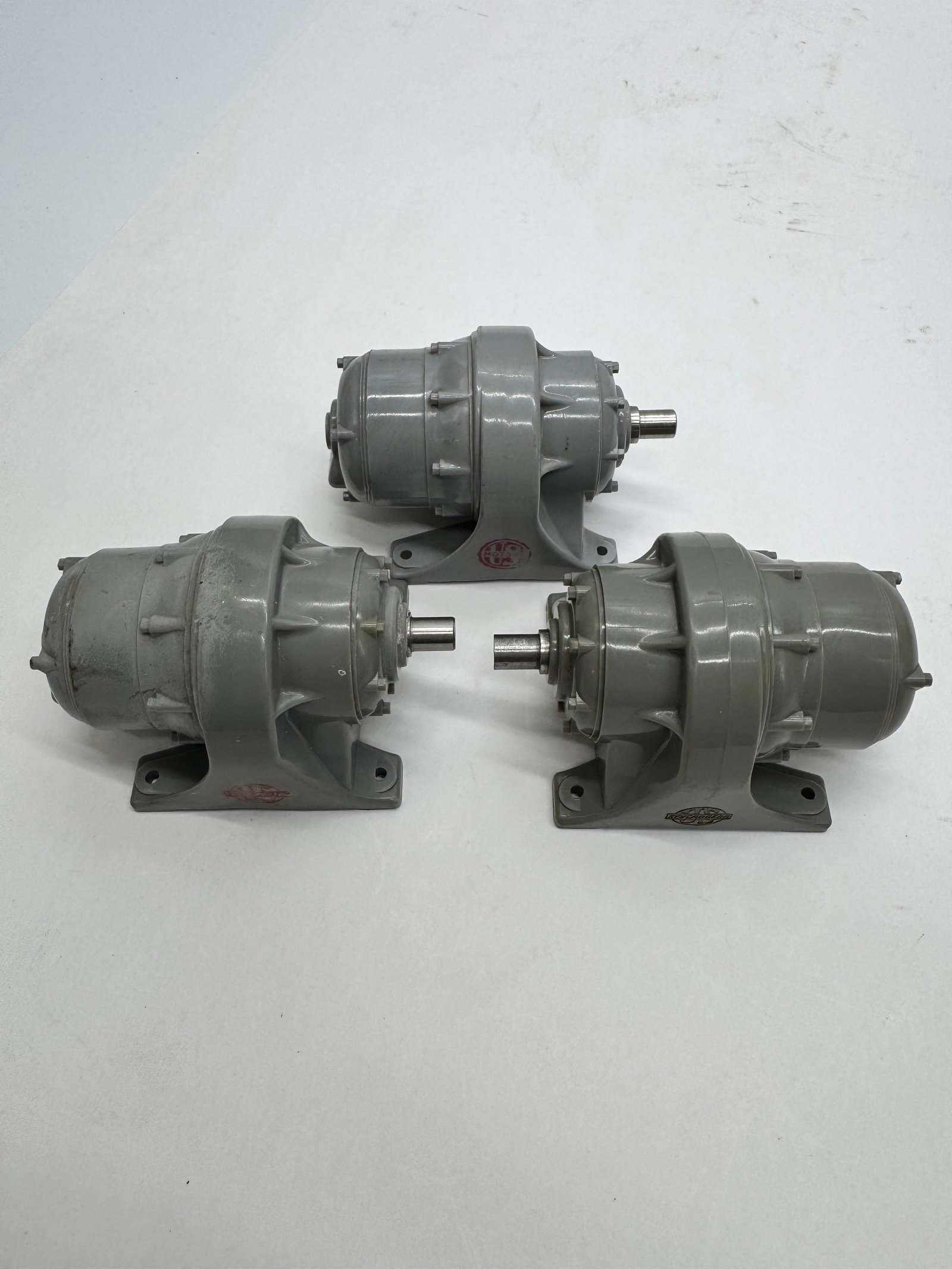 Set of 3 U.S. Electrical Motors Inc. Salesman Sample Display Motors: Vintage lot of three U.S. Electrical Motors Inc. miniature display motors. Cast metal construction with original gray finish and embossed company markings. Likely salesman samples or promotional displ