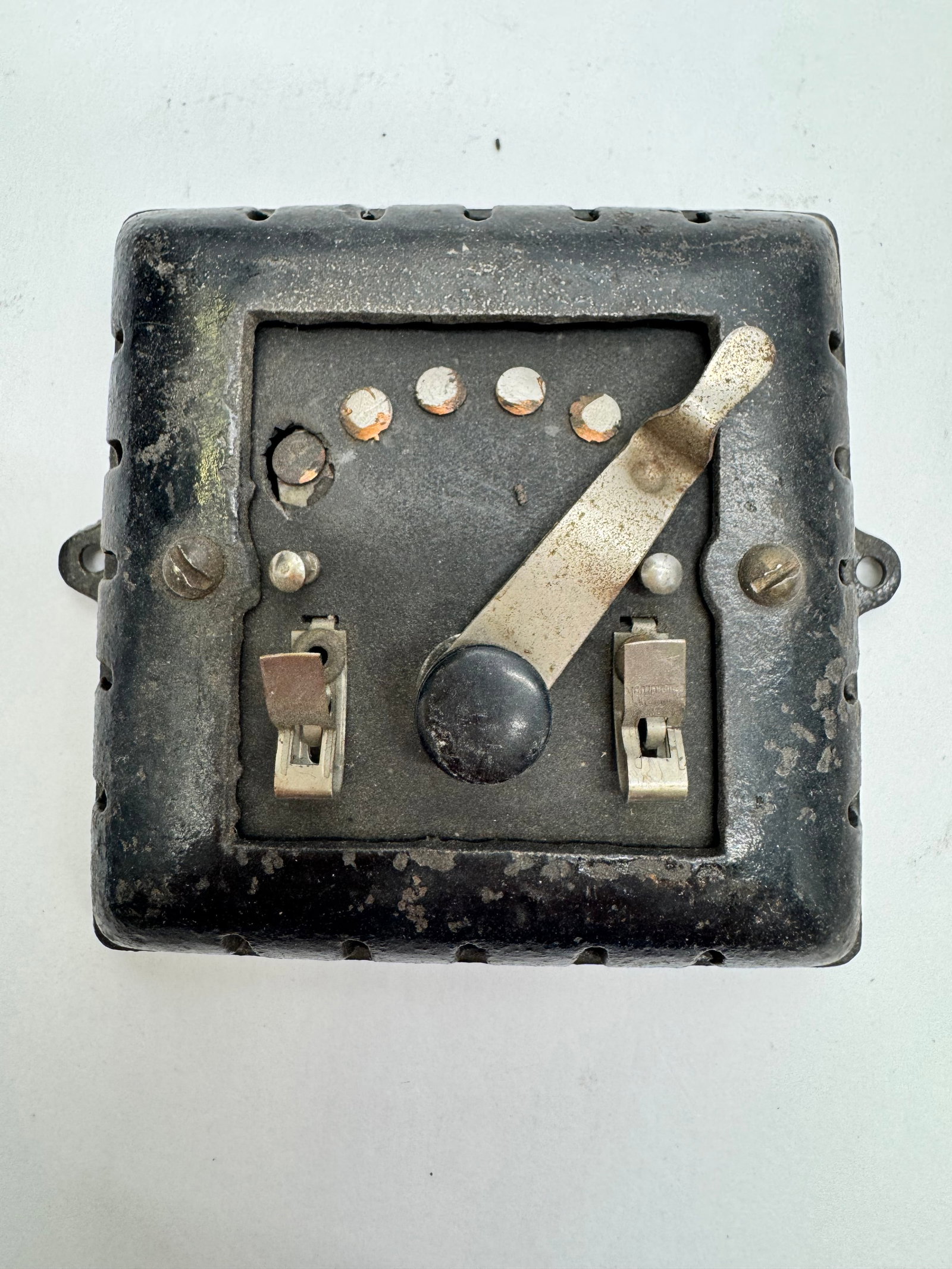 Antique Cast Iron Electrical Wall Switch Controller c.1910–1925: Antique cast iron wall-mounted electrical switch/controller featuring a black cast iron vented housing, nickel-plated lever, and dual spring contacts. Suitable for early doorbell, telephone, annunciat