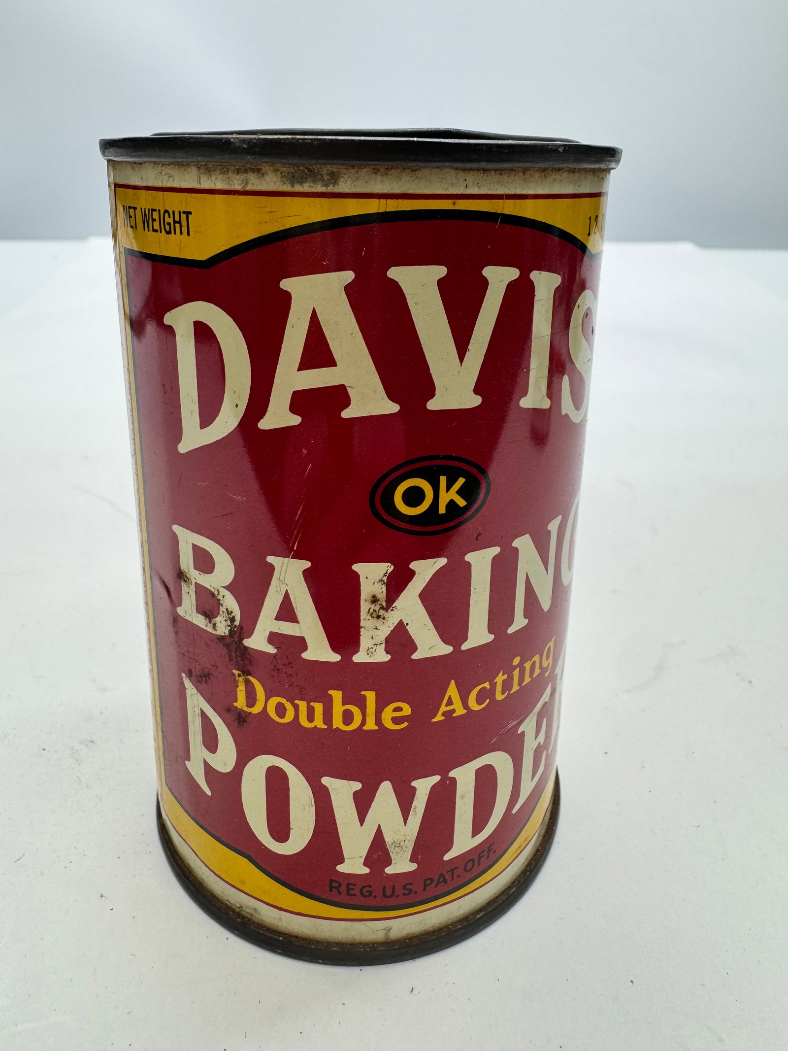Vintage Davis Double Acting Baking Powder Advertising Tin – Hoboken, NJ: Vintage Davis Double Acting Baking Powder advertising tin, manufactured in Hoboken, New Jersey, circa 1930s–1950s. Features colorful red, white, and yellow lithographed graphics and classic mid-cent