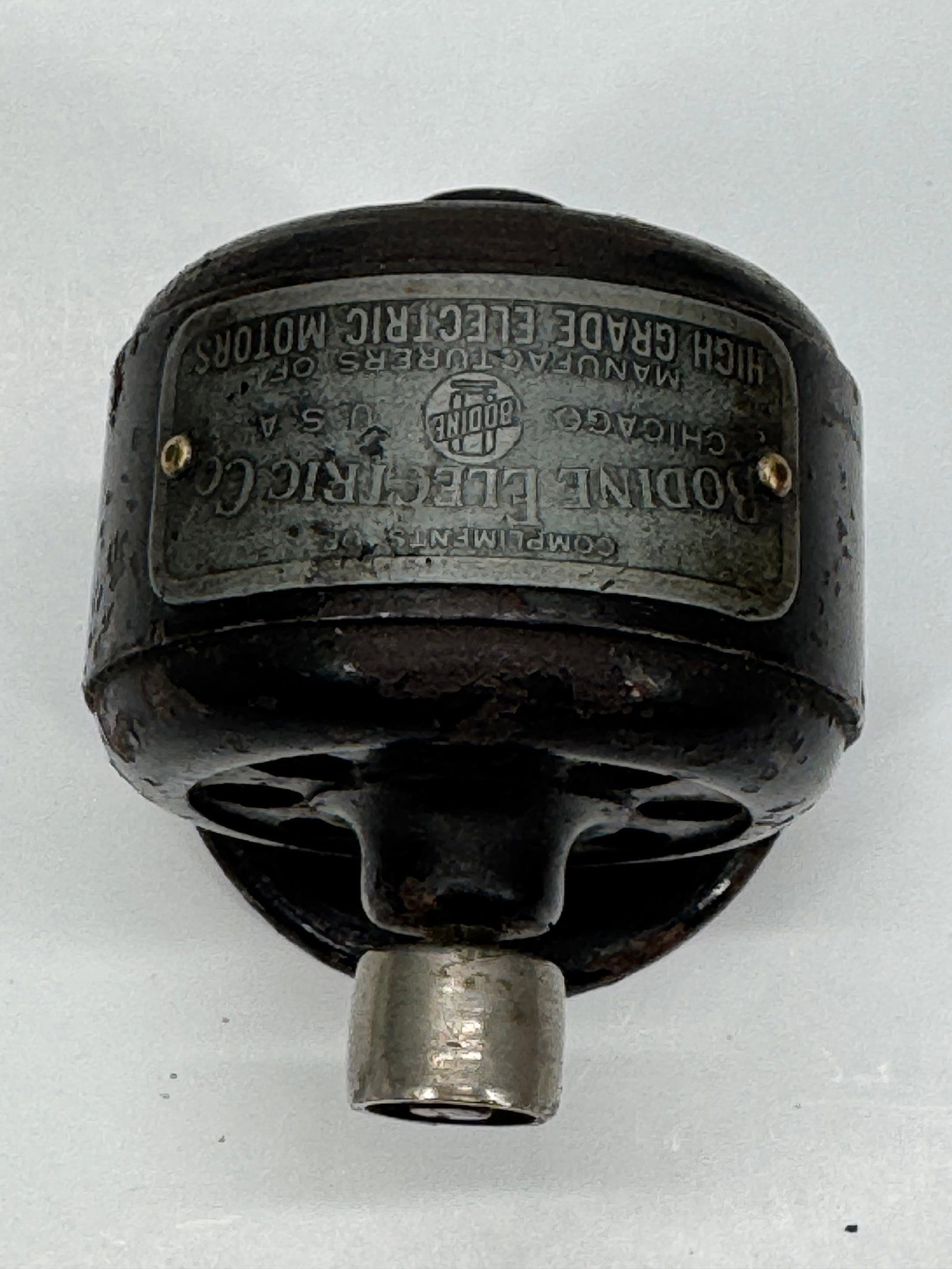 Vintage Bodine Electric Co. Motor Paperweight: Vintage Bodine Electric Company paperweight in the form of a miniature electric motor. Cast metal construction with original Bodine identification plate. A scarce advertising collectible for enthusias