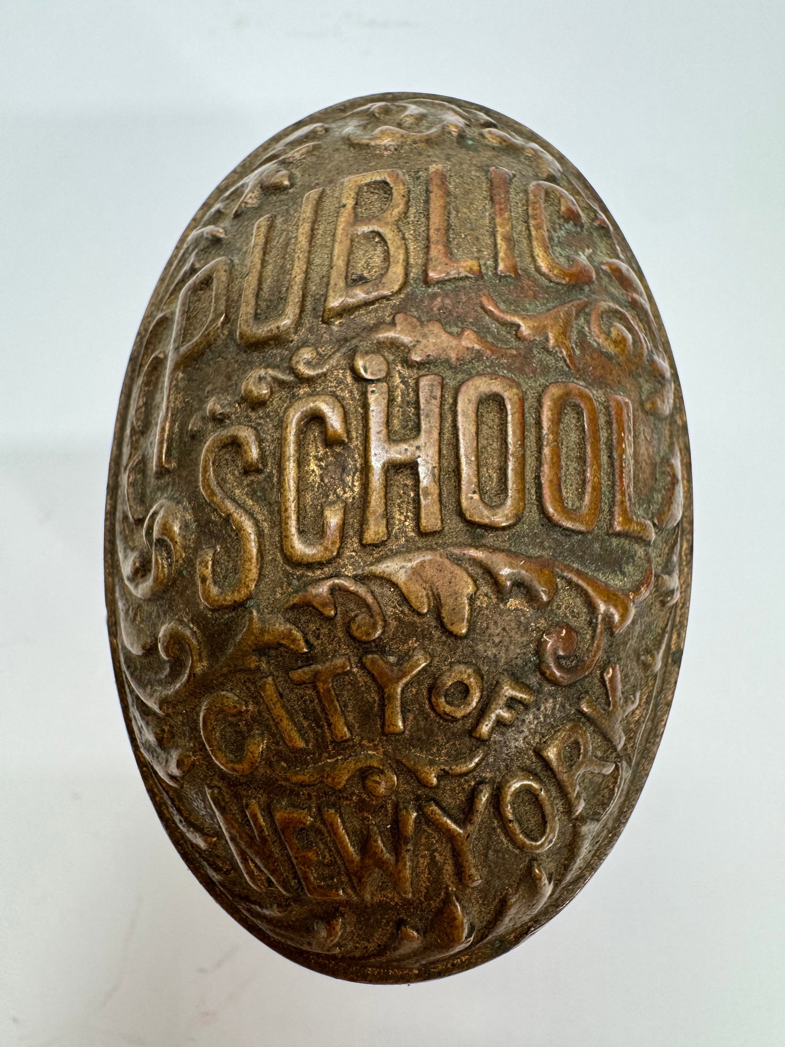 Antique Public School City of New York Brass Door Handle: Original antique brass door handle marked “Public School City of New York,” dating to the early 20th century. Heavy cast brass construction with raised lettering, originally used on doors in N
