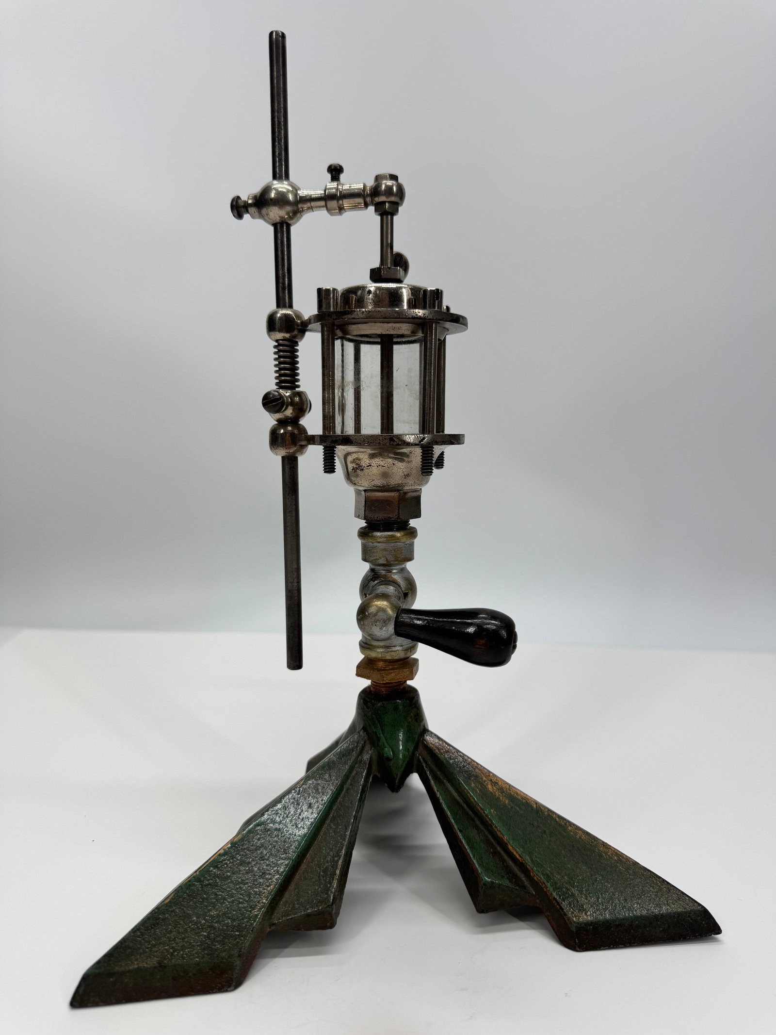 Antique Vertical 3-Ball Flyball Governor Steam Engine: Antique vertical 3-ball flyball governor for a steam or hit-and-miss stationary engine, dating to the late 19th or early 20th century. Features a cast iron tripod base, adjustable vertical support, gl