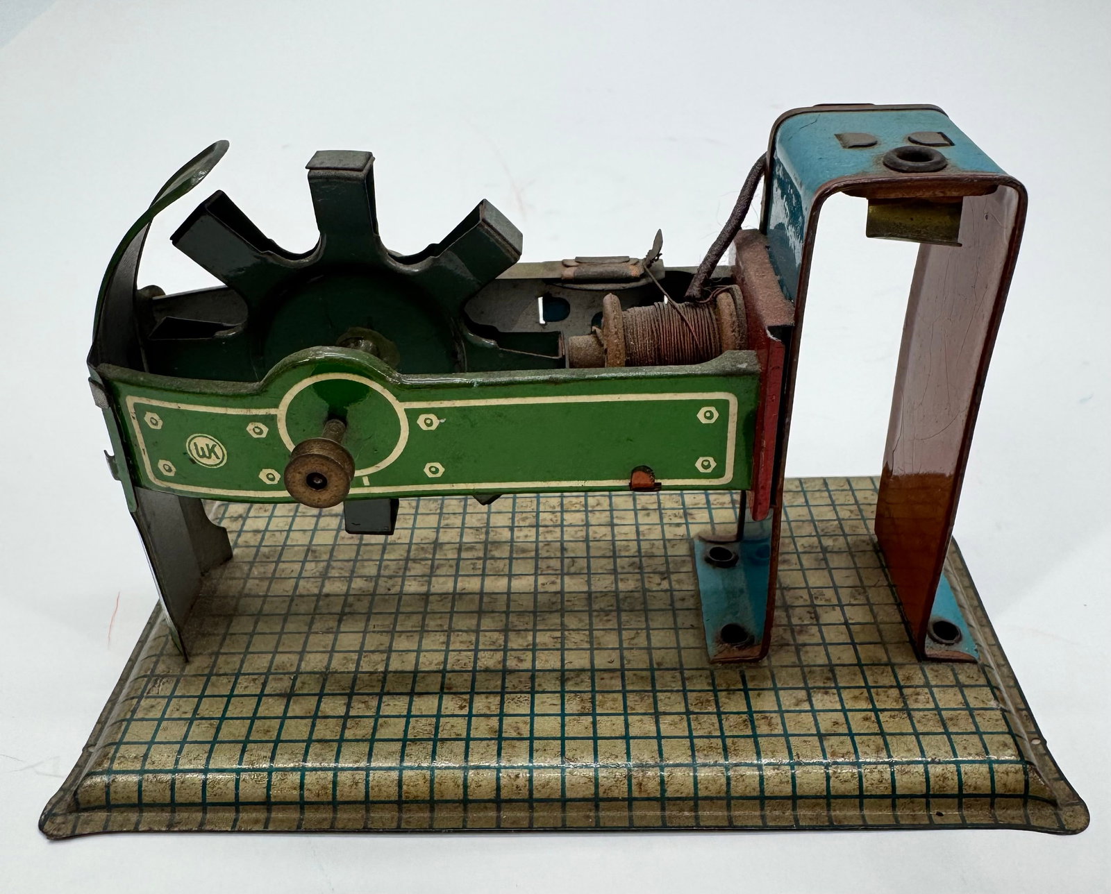 Antique German Tinplate Electromagnetic Demonstration Model: Vintage German tinplate electromagnetic demonstration model, marked “Made in Germany” with the WK logo. Features a hand-painted green tin housing, large notched flywheel, exposed electromagnet
