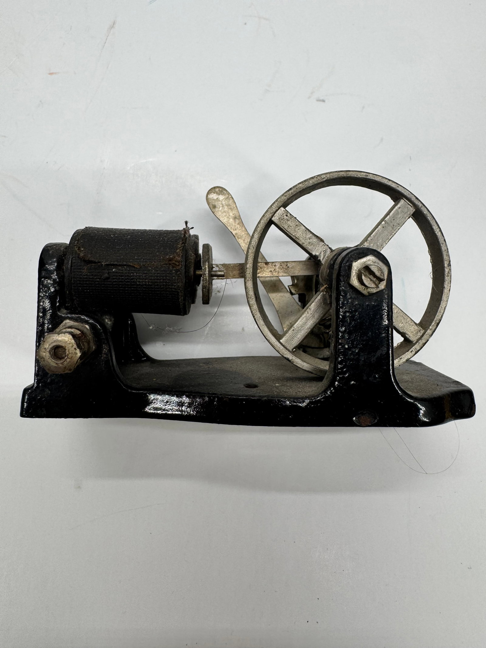 Mesco Toy Electric Motor: Original antique Mesco toy electric motor dating to the early 1900s. Features a cast iron base with exposed armature, flywheel, and field coil, characteristic of early Mesco educational and demonstrat