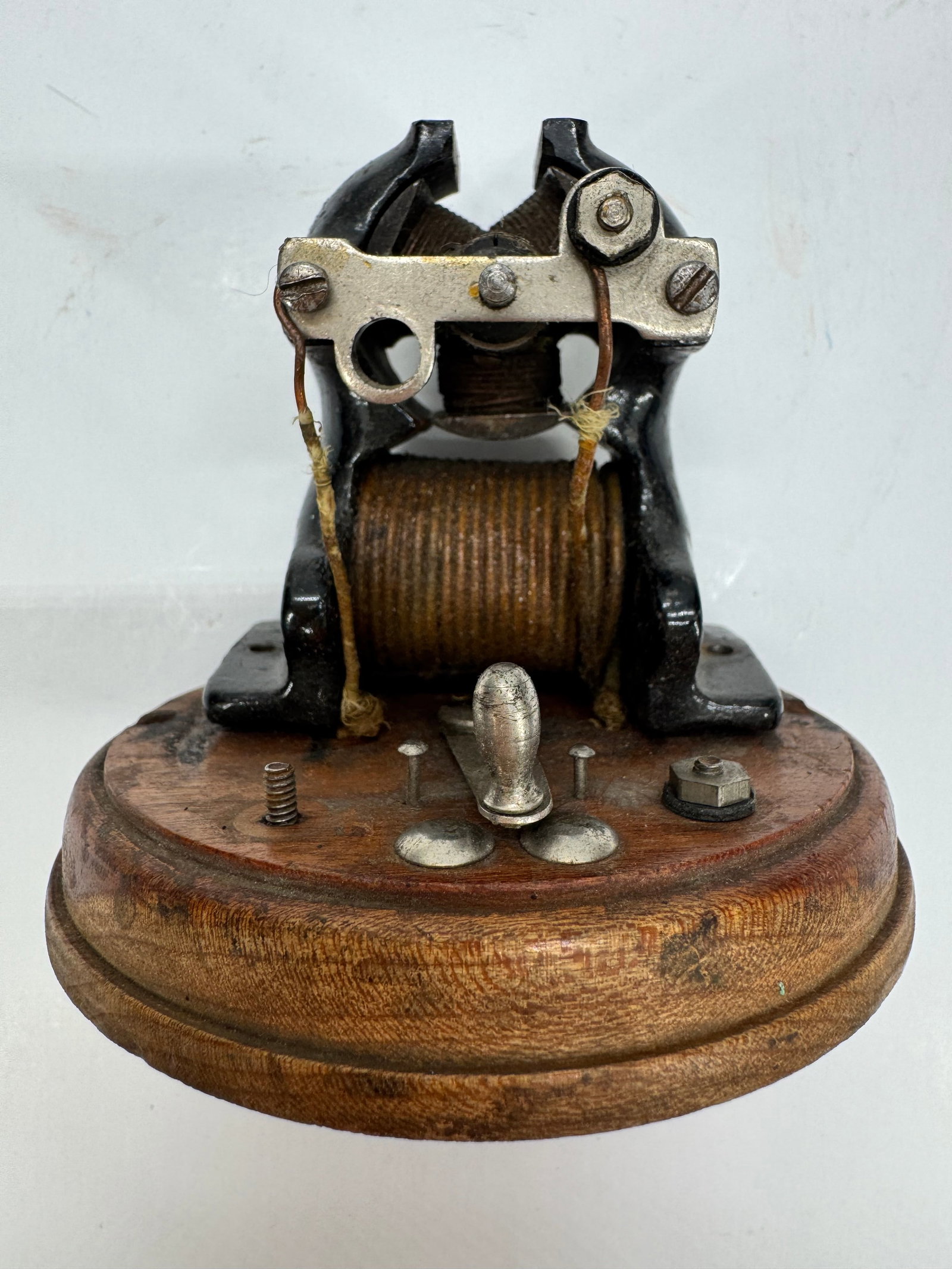 Vintage Ajax Toy Electric Motor Cast Iron Wood Base c.1910: Vintage Ajax toy electric motor dating to around 1910. Features a cast iron frame mounted on a hardwood base with a balanced 3-segment armature. Designed to operate on approximately 1–6 volts, these