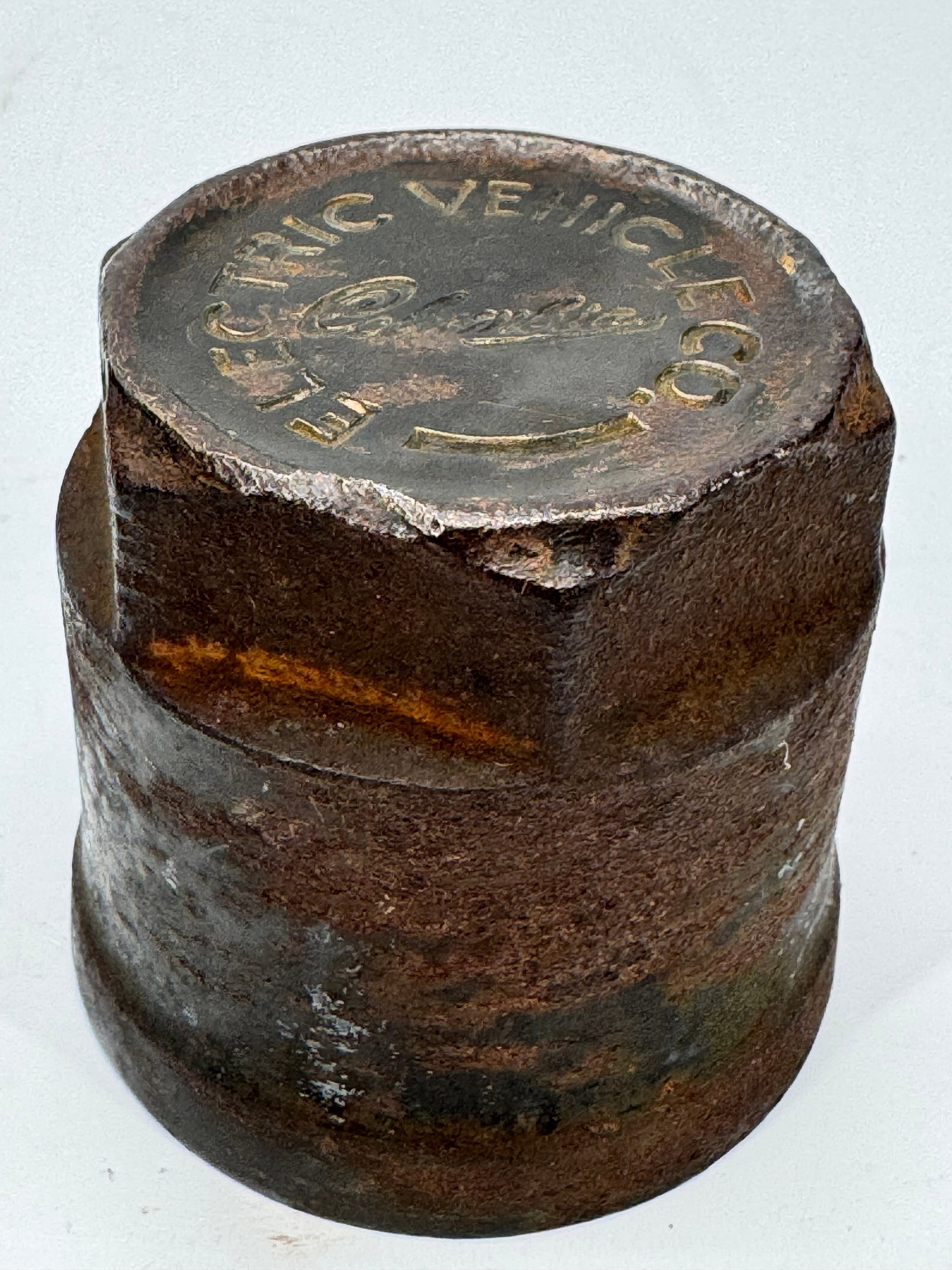 1903 Columbia Electric Vehicle Co. Cast Iron Hub Cap: Original Columbia Electric Vehicle Co. cast iron hub cap dating to 1903 or earlier. Embossed “Electric Vehicle Co. Columbia” with raised lettering and a threaded interior. An authentic early a