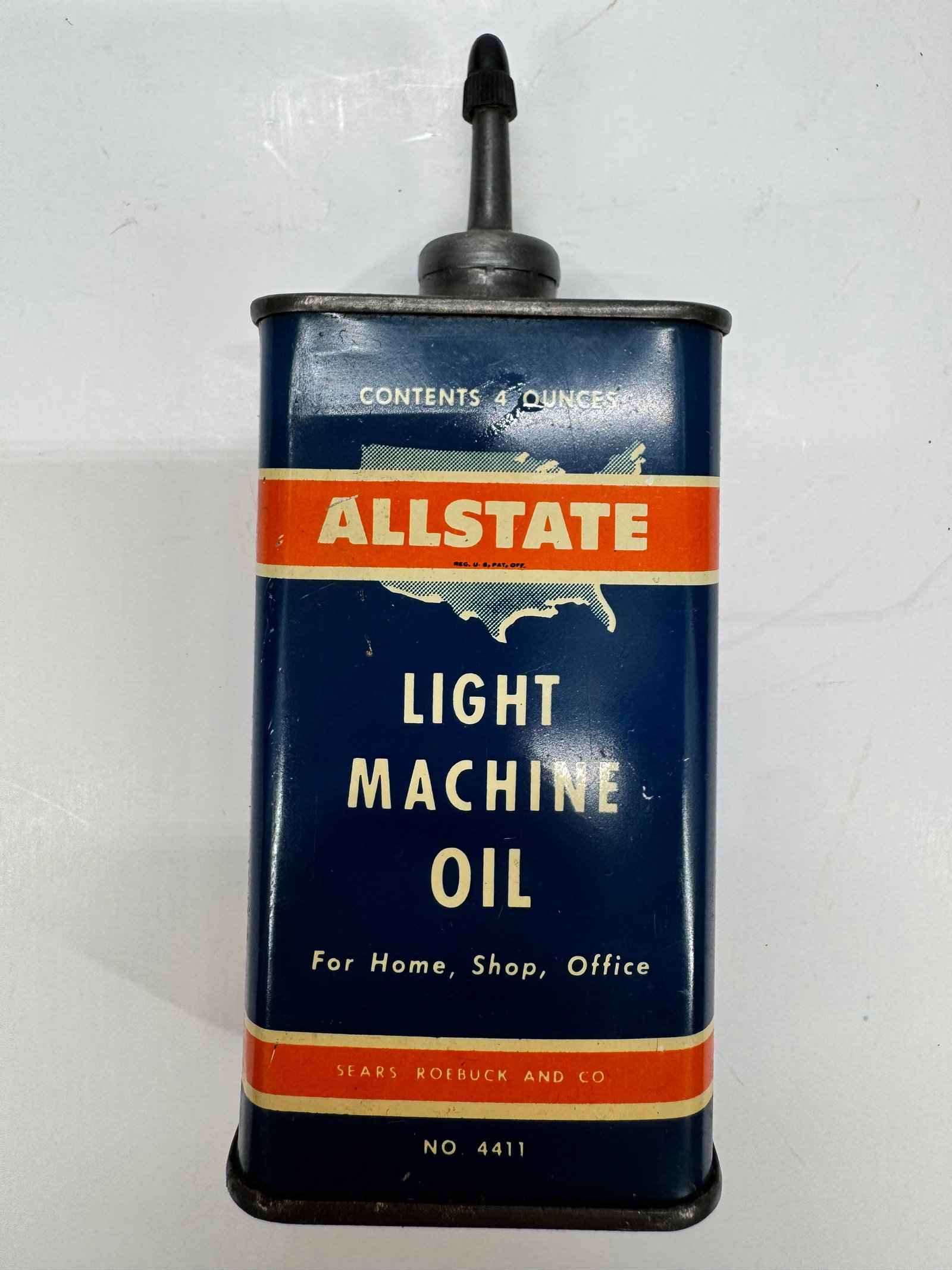 Vintage Allstate Light Machine Oil 4 Oz Tin Oiler Sears No. 4411: Vintage Allstate Light Machine Oil 4-ounce tin oiler sold by Sears, Roebuck and Co. Marked No. 4411, this original metal oil can features its factory spout and colorful blue, orange, and white graphic