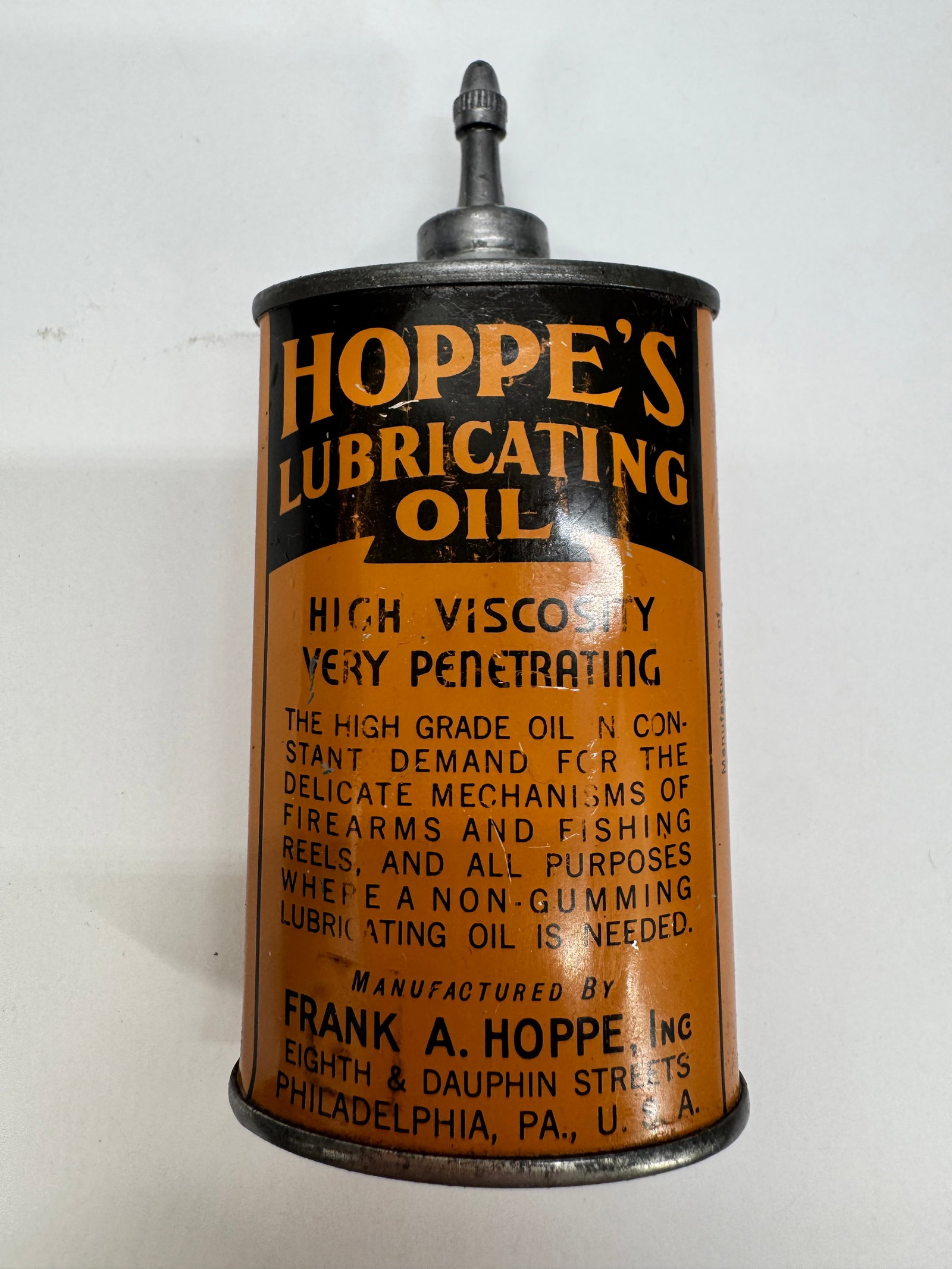 Vintage Hoppe’s Lubricating Oil Tin Oiler Frank A. Hoppe Philadelphia: Vintage Hoppe’s Lubricating Oil tin oiler manufactured by Frank A. Hoppe, Inc., Philadelphia, PA. Features the original black and orange graphics, metal spout, and advertising for use on firearms, f