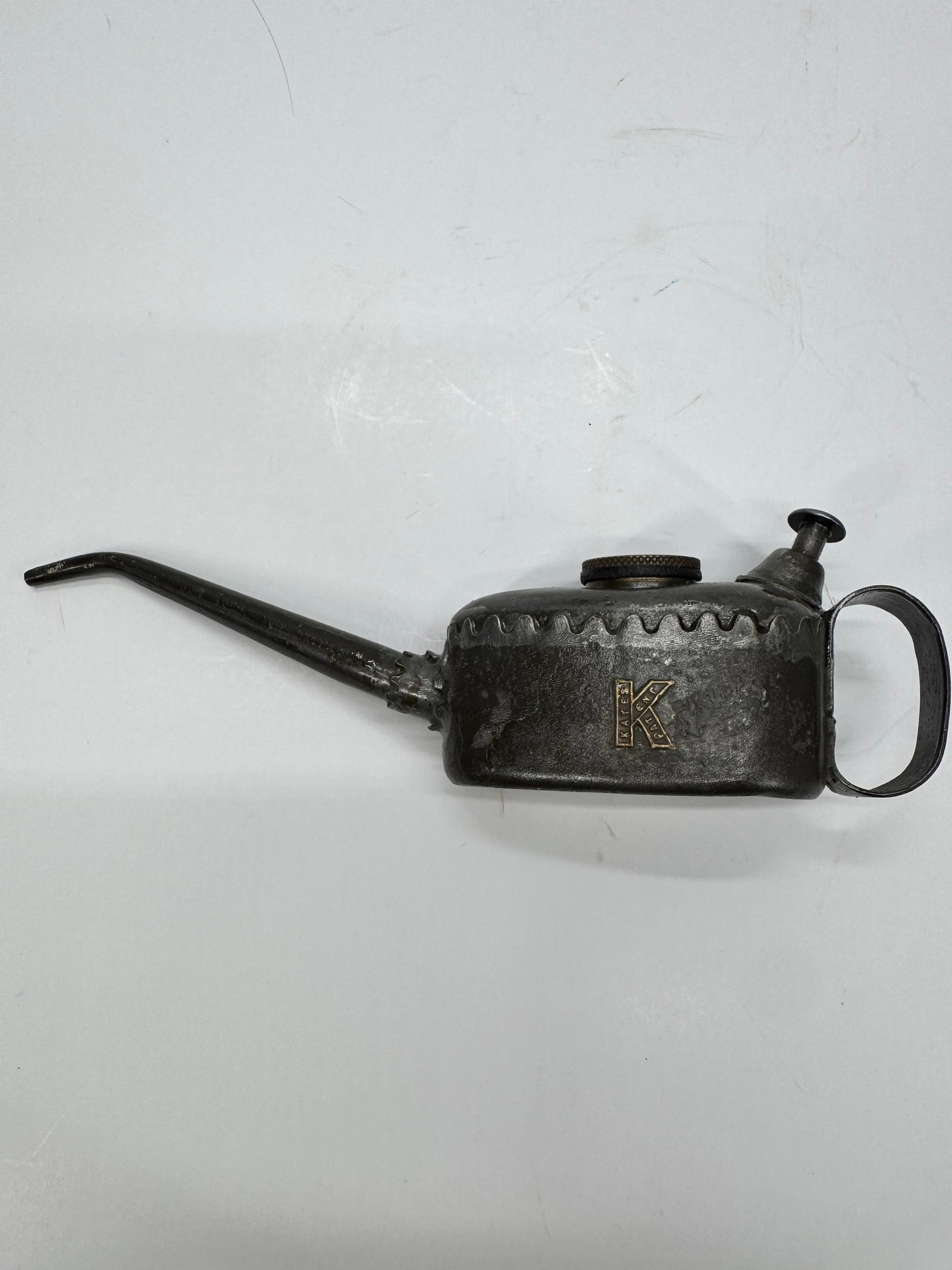 Vintage K-Rated Eagle Spout Oil Can Oiler: Vintage metal hand oil can featuring the K Rated logo with a long precision spout, thumb pump, and integrated handle. Finished in black with embossed branding, this oiler was designed for lubricating 