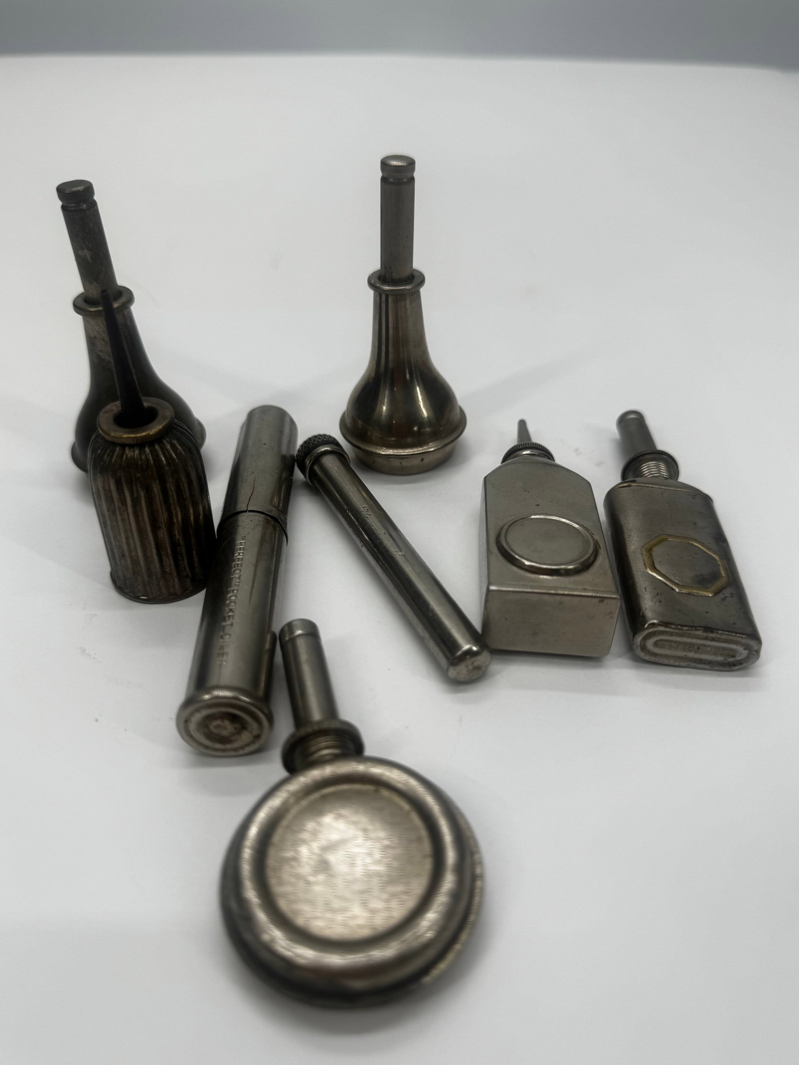 Lot of 8 Vintage Metal Pocket Oilers & Precision Machine Oil Cans: Lot of eight vintage metal pocket oilers and precision machine oil cans in assorted styles and sizes. Includes cylindrical, rectangular, and bulb-form oilers with long spouts for lubricating sewing ma