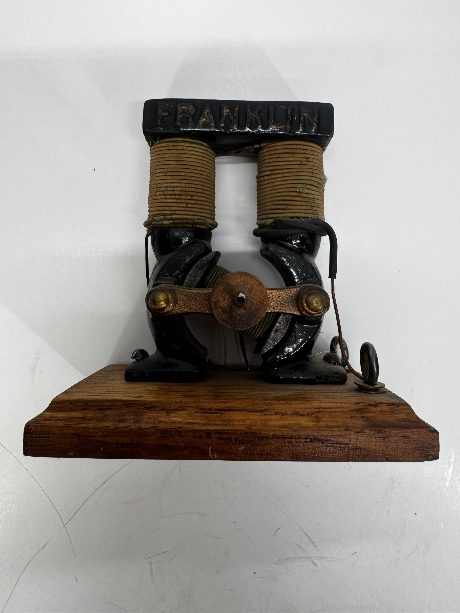Antique Franklin Bipolar Electric Motor Toy Demonstration Motor on Wood Base: Antique Franklin Bipolar electric motor, dating to the early 1900s. Features dual wire-wound field coils, cast iron frame, and original wooden base. Marked “FRANKLIN” on the top yoke. These ba