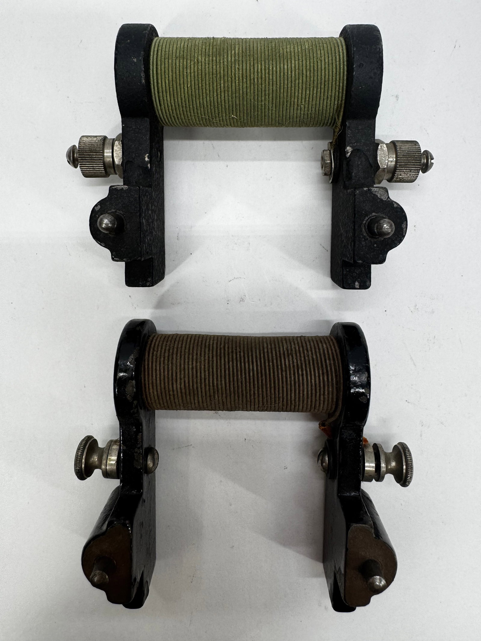 Antique Wire-Wound Rheostats Variable Resistors Pair: Pair of antique wire-wound rheostats with cast iron frames, ceramic resistance coils, and nickel-plated adjustment terminals. These early variable resistors were used to regulate current in laboratory