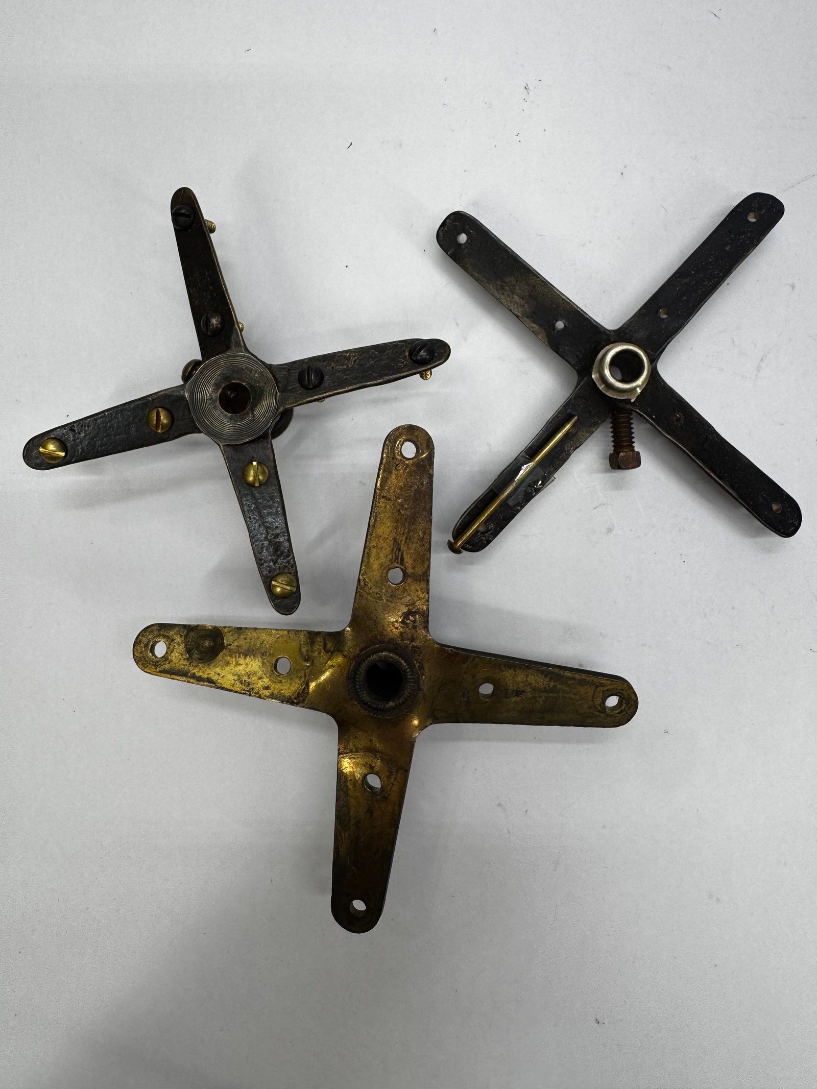 Lot of Vintage Cast Iron 4 Fan blade hubs: Lot of vintage cast iron four-blade fan blades Hubsfrom antique electric fans. These early fan blades feature a classic four-spoke design with center mounting hubs and are suitable for restoring antiq