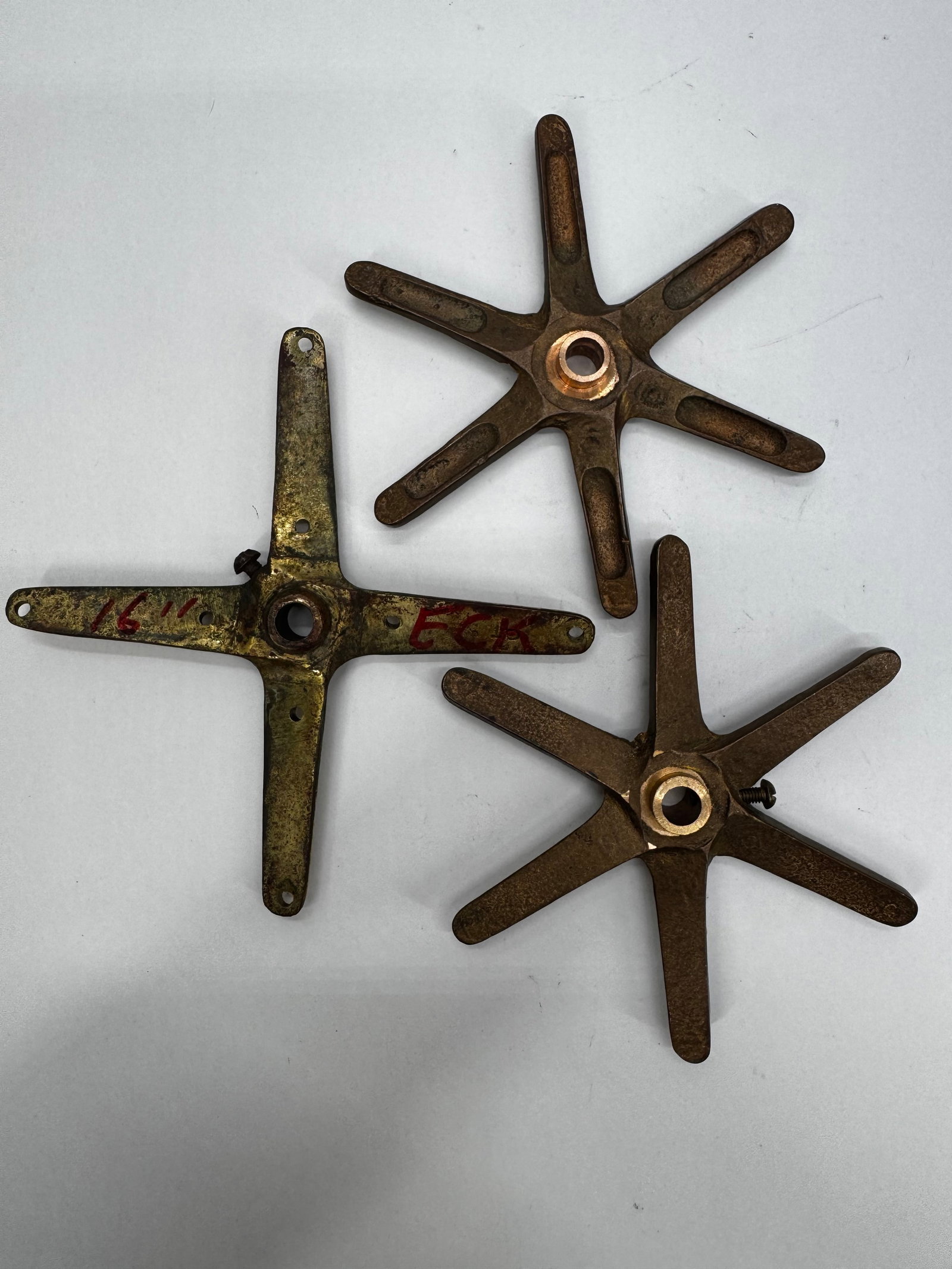 Lot of Vintage Brass Edison Electric Fan Blade Hubs & Assemblies: Lot of vintage brass fan blade hubs and blade assemblies from antique Edison electric fans. These early components feature a four-spoke star design with central mounting hubs and were used on early el