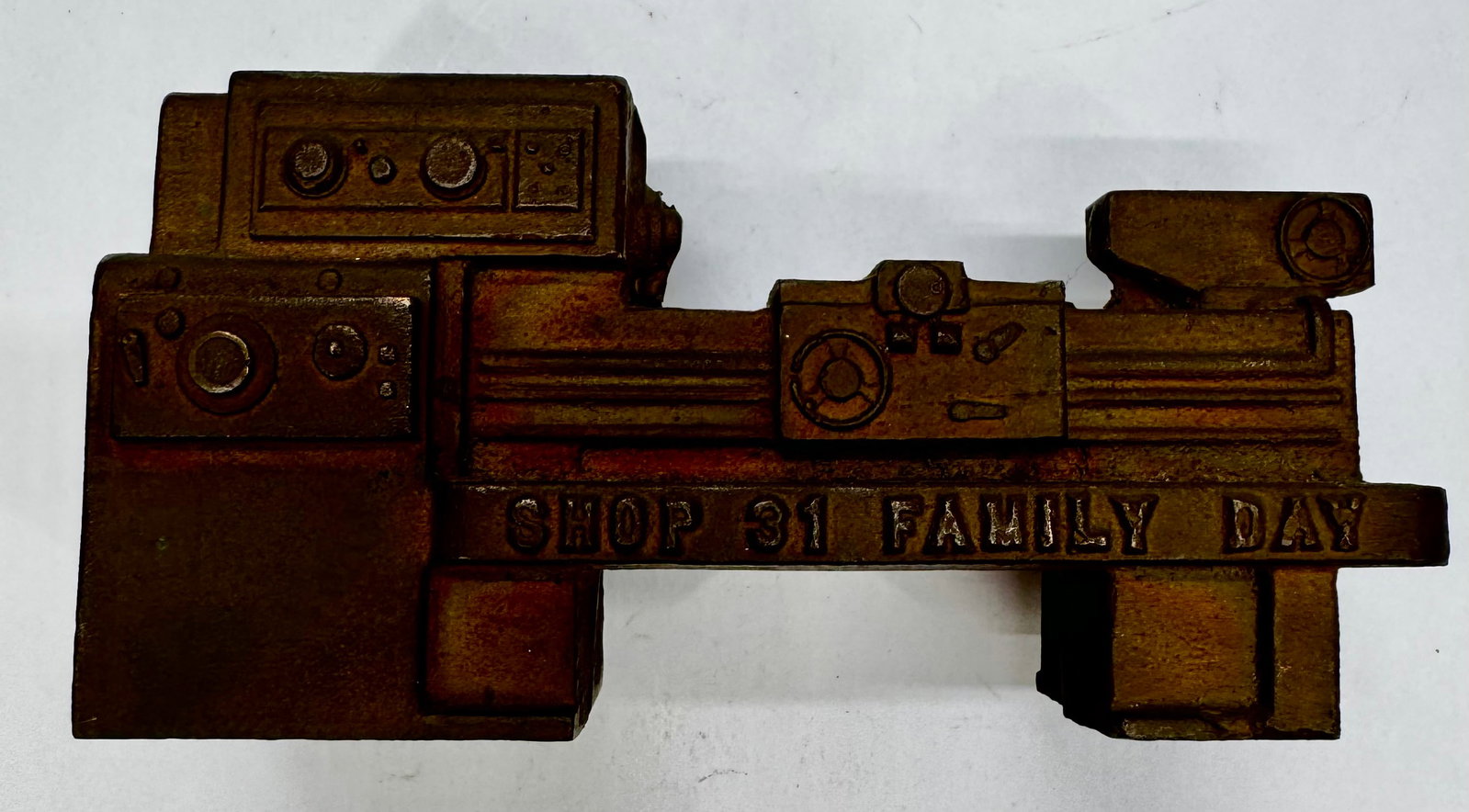 Vintage Lathe Machine Paperweight Shop 31 Family Day: Vintage cast metal miniature lathe machine desk ornament or paperweight, commemorating “Shop 31 Family Day.” Features a detailed machine tool replica with a dark aged finish, likely cast iron 