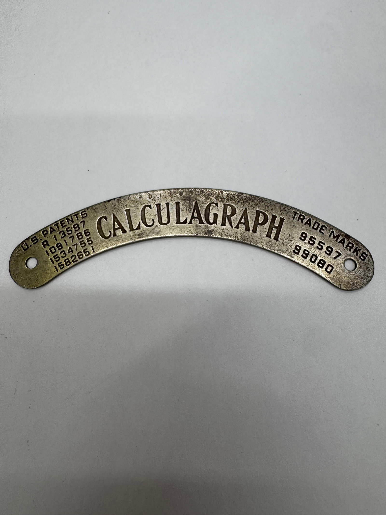 Vintage Calculagraph Brass Industrial Timer Nameplate: Vintage Calculagraph brass or nickel-plated metal nameplate from a Calculagraph commercial timer or industrial time recorder. Features the embossed “CALCULAGRAPH” logo with U.S. patent and tra