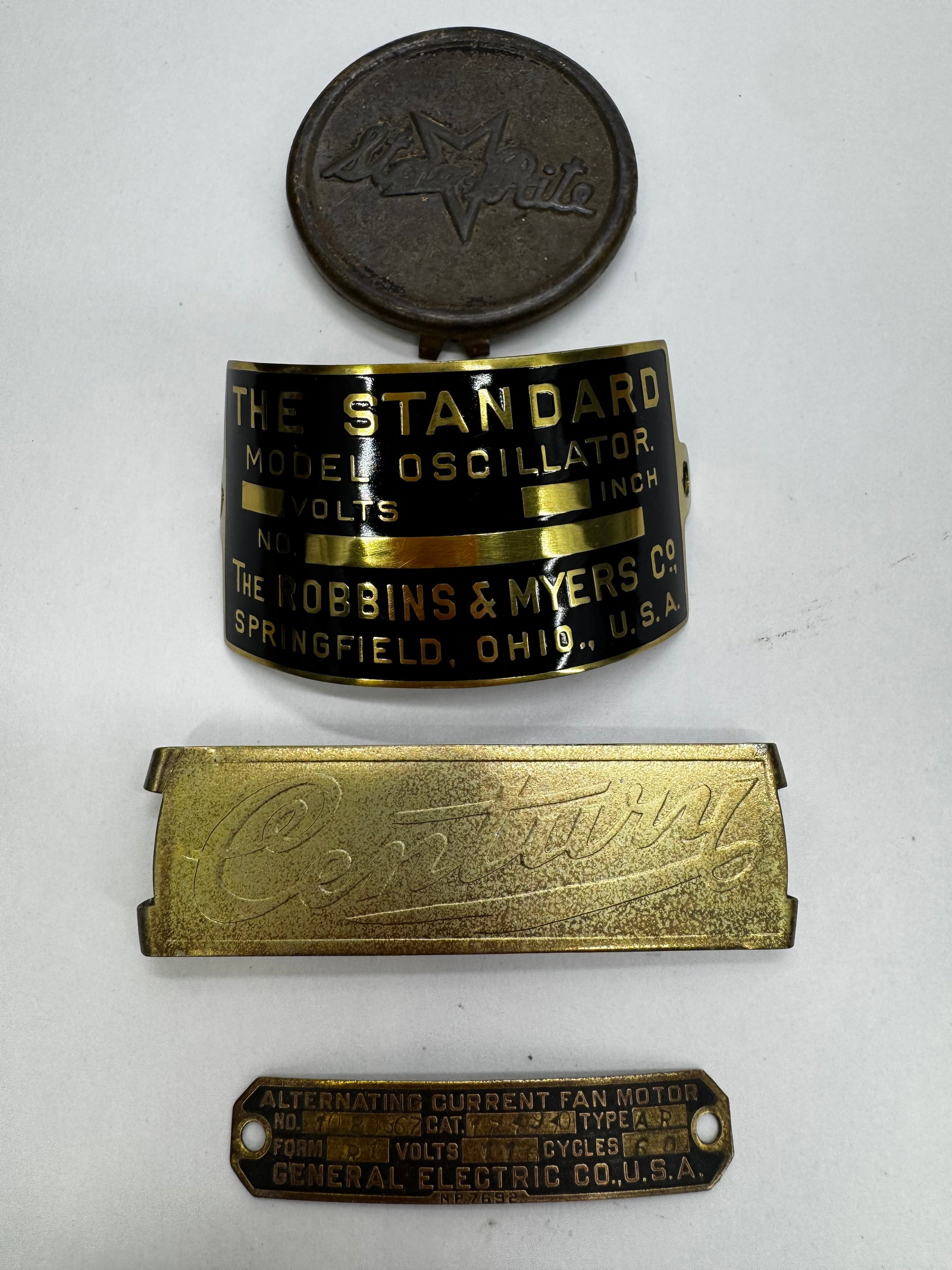 Lot of 4 Vintage Electric Fan & Motor Nameplates: Lot of four vintage electric fan and motor nameplates and badges including General Electric, Robbins & Myers “Standard Model Oscillator”, Century, and White. Constructed of brass, aluminum, an