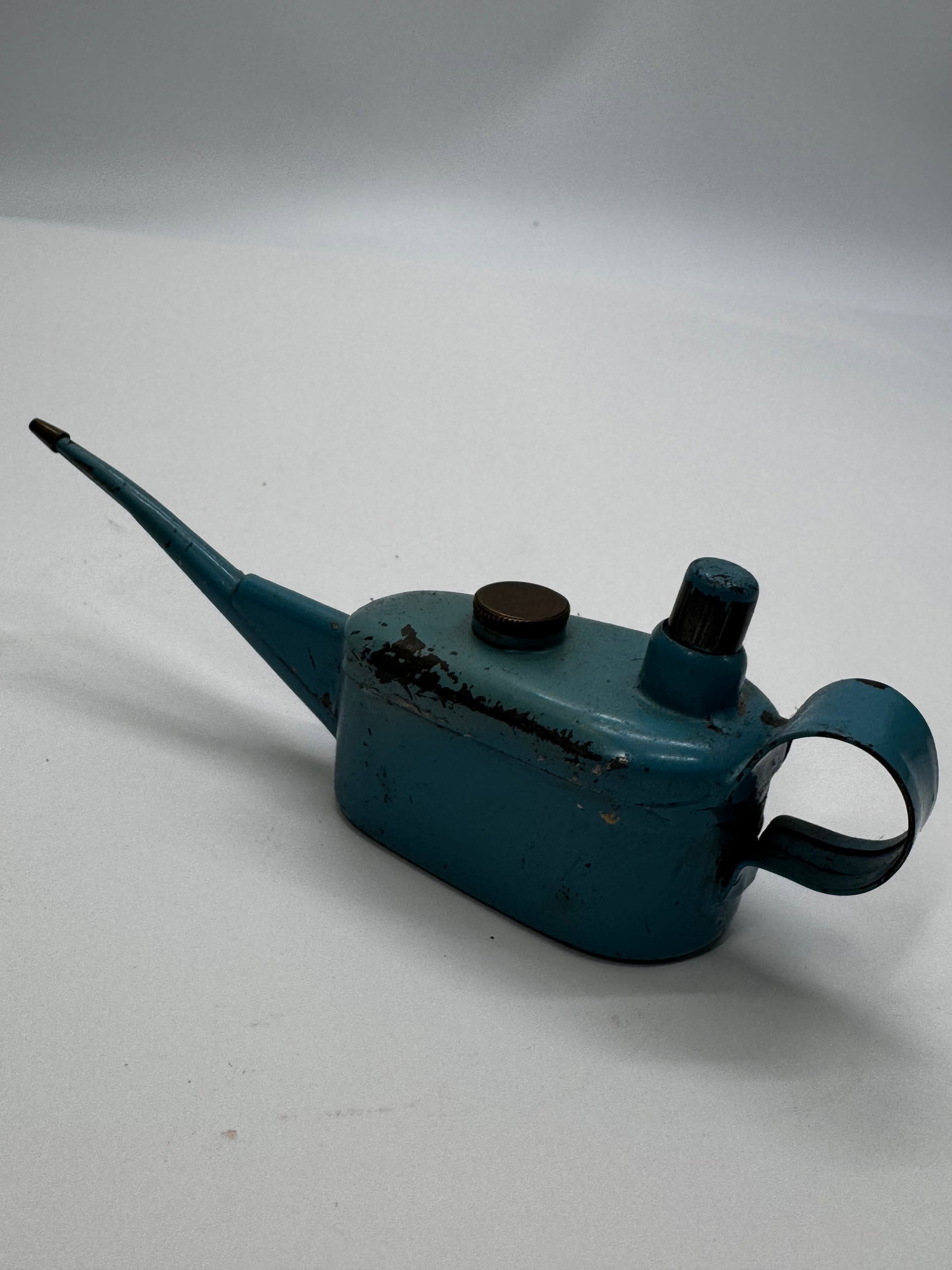 Vintage Blue Pump Oil Can Trigger Oiler Long Spout: Vintage blue-painted steel pump oil can with a long precision spout, thumb-operated plunger, and finger loop handle. Designed for applying oil to machinery, electric motors, tools, and other mechanica