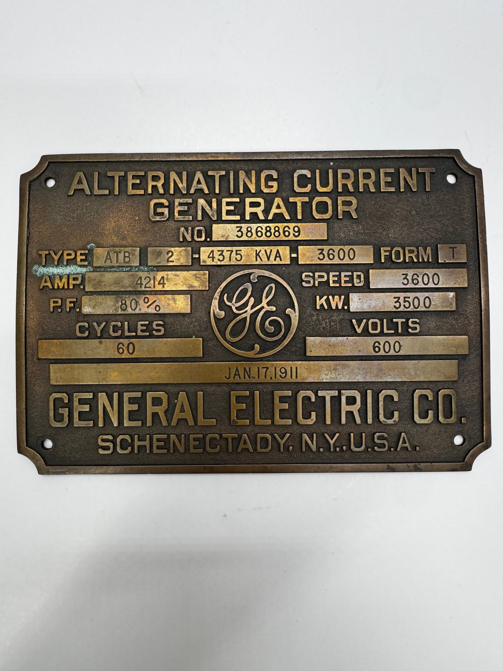Antique GE Alternating Current Generator Bronze Nameplate: Original cast bronze General Electric Co. Alternating Current Generator nameplate from Schenectady, New York. Features the classic raised GE logo and machine specifications including Type ATB-2, 4375 