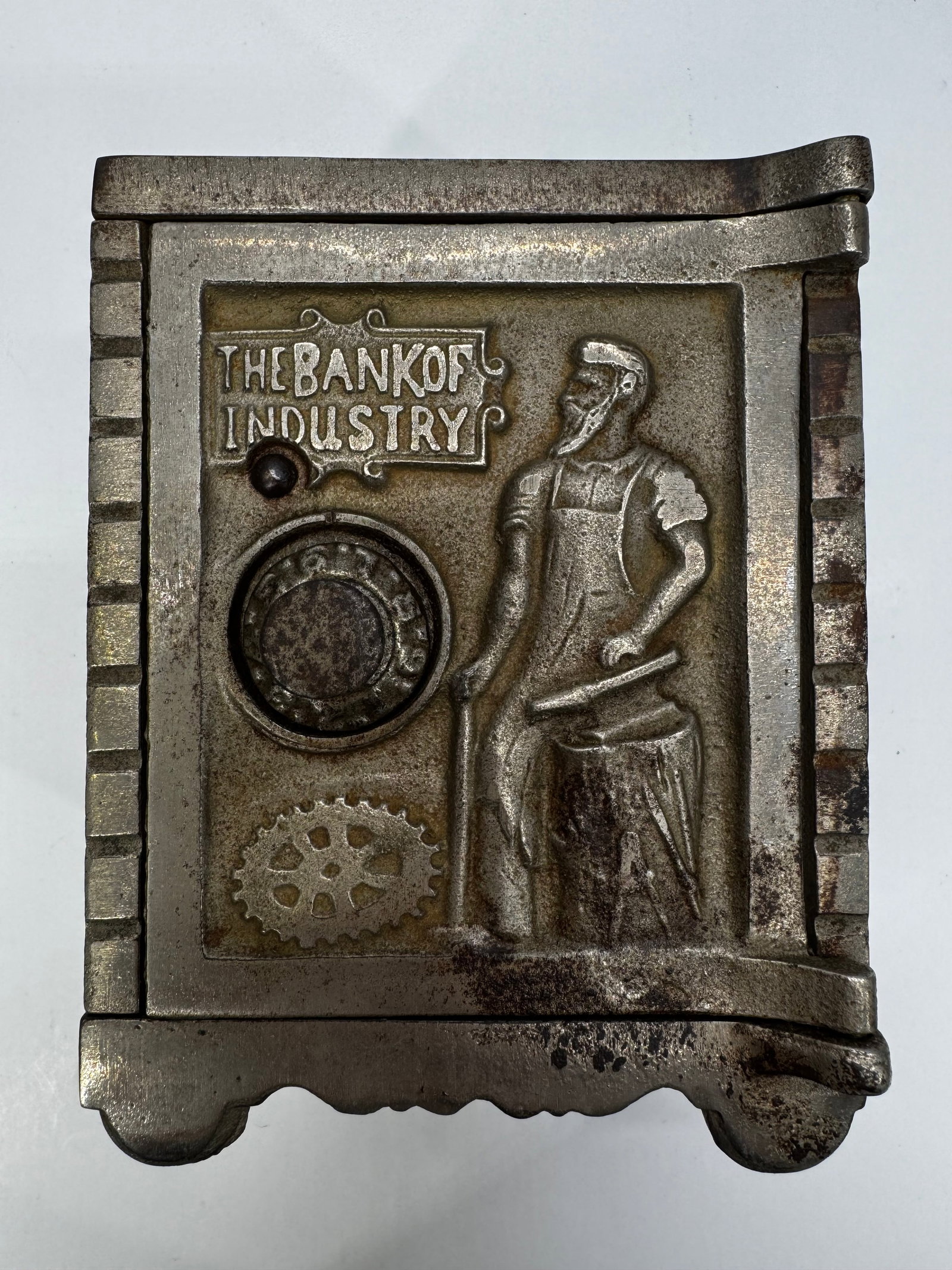 Antique Kenton “Bank of Industry” Cast Iron Mechanical Coin Bank c.1900: Authentic antique Kenton Brand “The Bank of Industry” cast iron coin bank, dating to the early 1900s (circa 1900–1932). The front door features an embossed blacksmith working at an anvil, sy