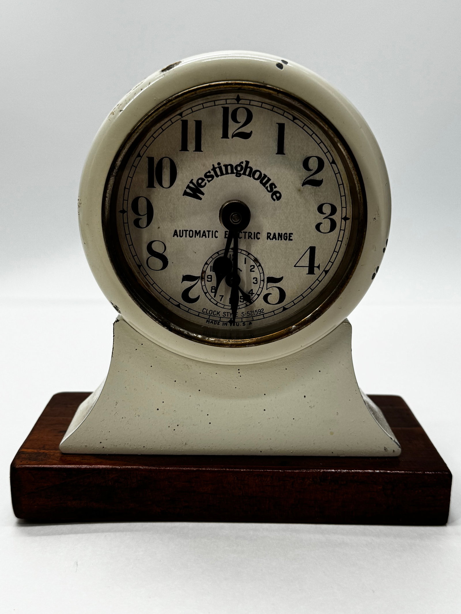 Vintage Westinghouse Automatic Electric Range Kitchen Clock: Vintage Westinghouse “Automatic Electric Range” kitchen clock made in the USA. Features a cream-painted metal case, large easy-to-read Arabic numerals, and a small seconds subdial. The back is