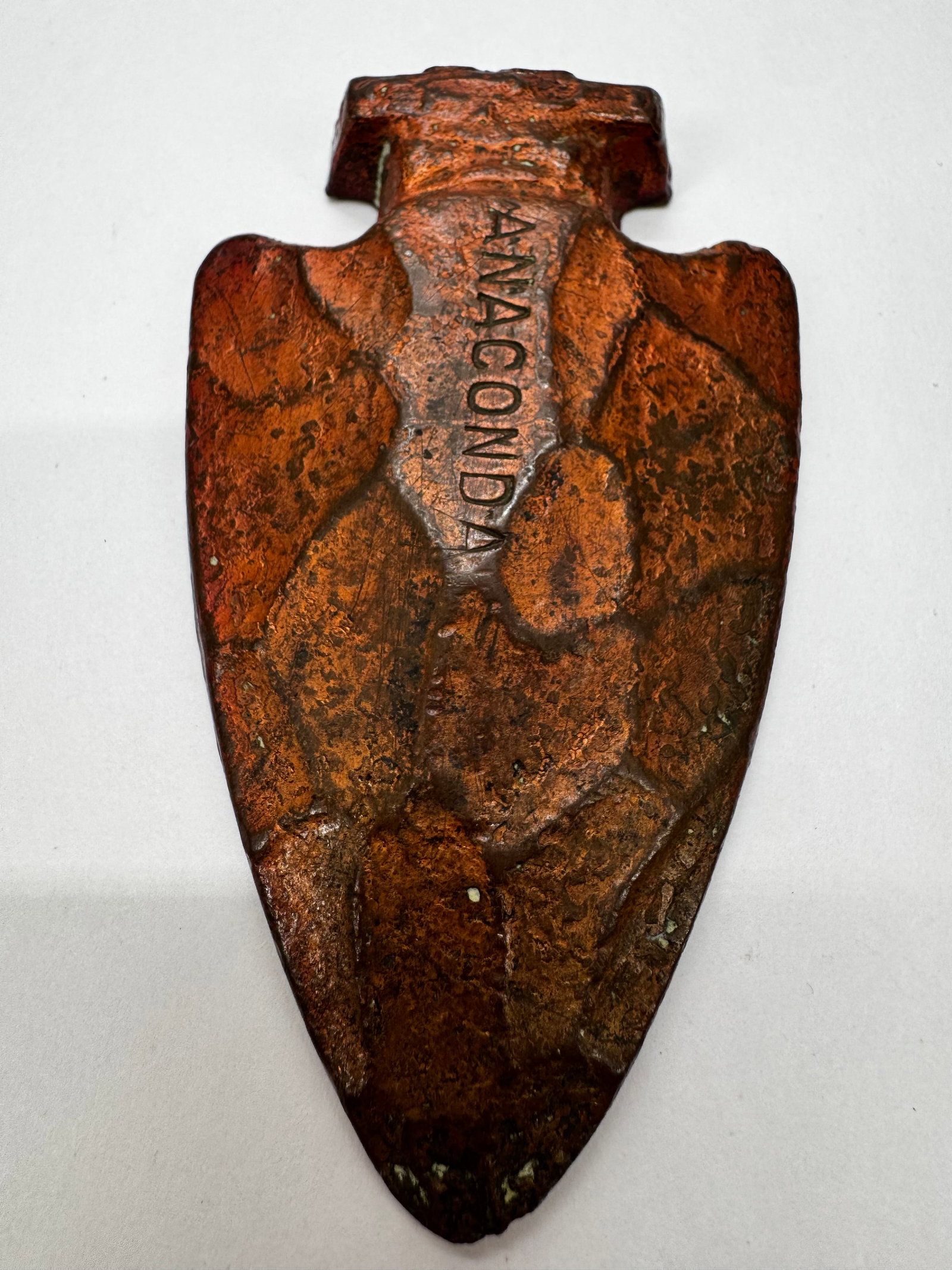 Antique Anaconda Copper Smelter Ingot Arrowhead Paperweight: Antique copper arrowhead-shaped ingot or paperweight embossed “ANACONDA.” Likely produced as a promotional or commemorative piece by the Anaconda Copper Mining Company. Features a heavy solid 